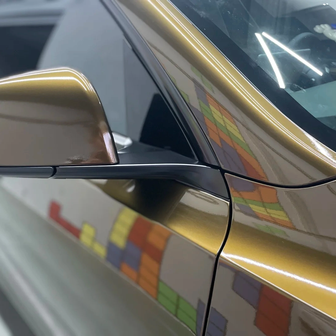 The Gloss Metallic Midnight Gold Car Vinyl Wrap is a premium automotive accessory designed to enhance the aesthetic appeal of any vehicle. 