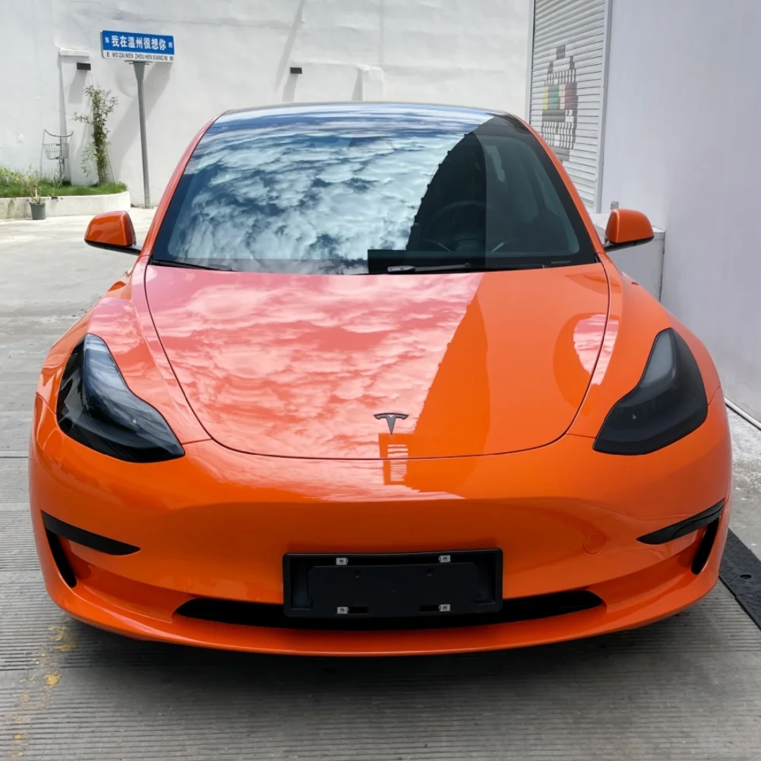 The Super Gloss Orange Car Vinyl Wrap offers a vibrant, high-gloss orange finish for cars.  It safeguarding the car against scratches and wear.