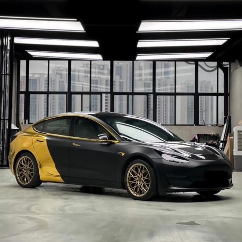 Revamping Tesla Elegance with Carwraponline’s Chrome Mirror Gold & Satin Black Vinyl Wraps