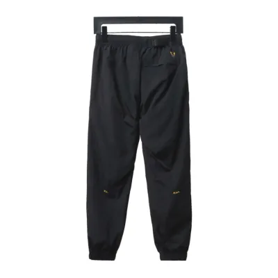 Nike x Drake NOCTA Series Zippered Cuffed Track Pants Black Gold 01