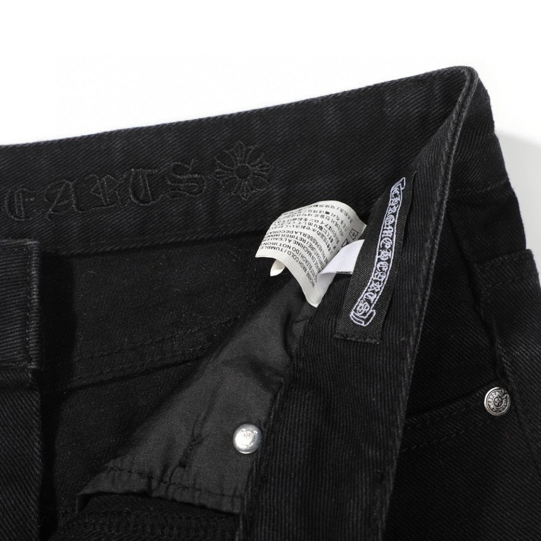 Chrome Hearts black denim jeans with pink and checkered cross patches