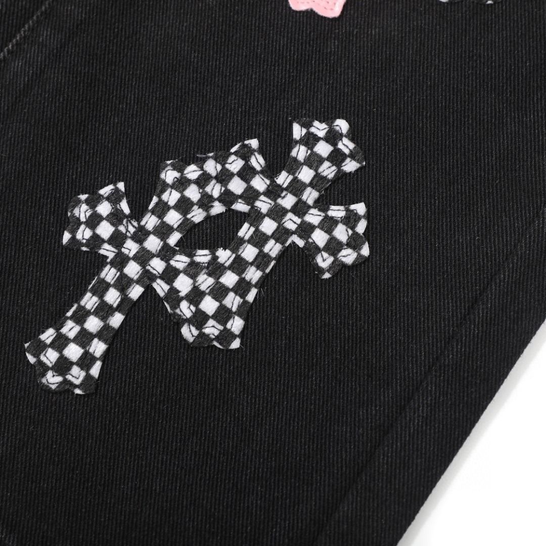 Chrome Hearts black denim jeans with pink and checkered cross patches