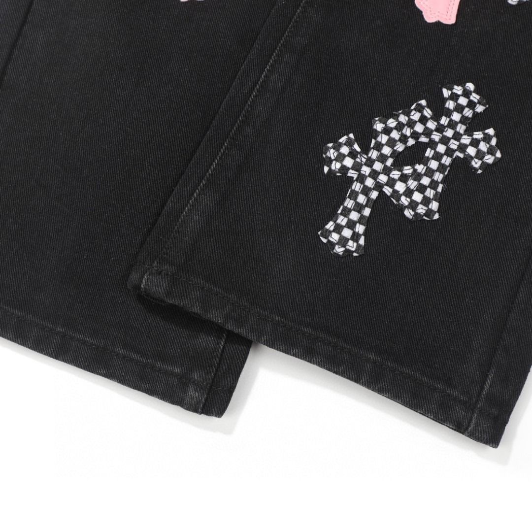 Chrome Hearts black denim jeans with pink and checkered cross patches