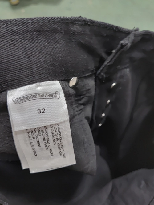 Chrome Hearts black denim jeans with pink and checkered cross patches reviewed by