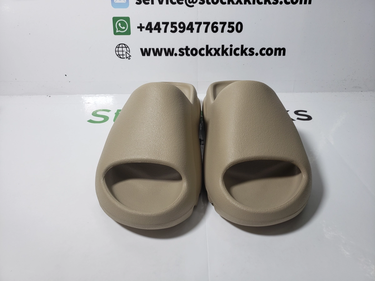 Fake shoes website stockx kicks sells cheap fake yeezy slides, including fake Yeezy Slide Pure Restock Pair