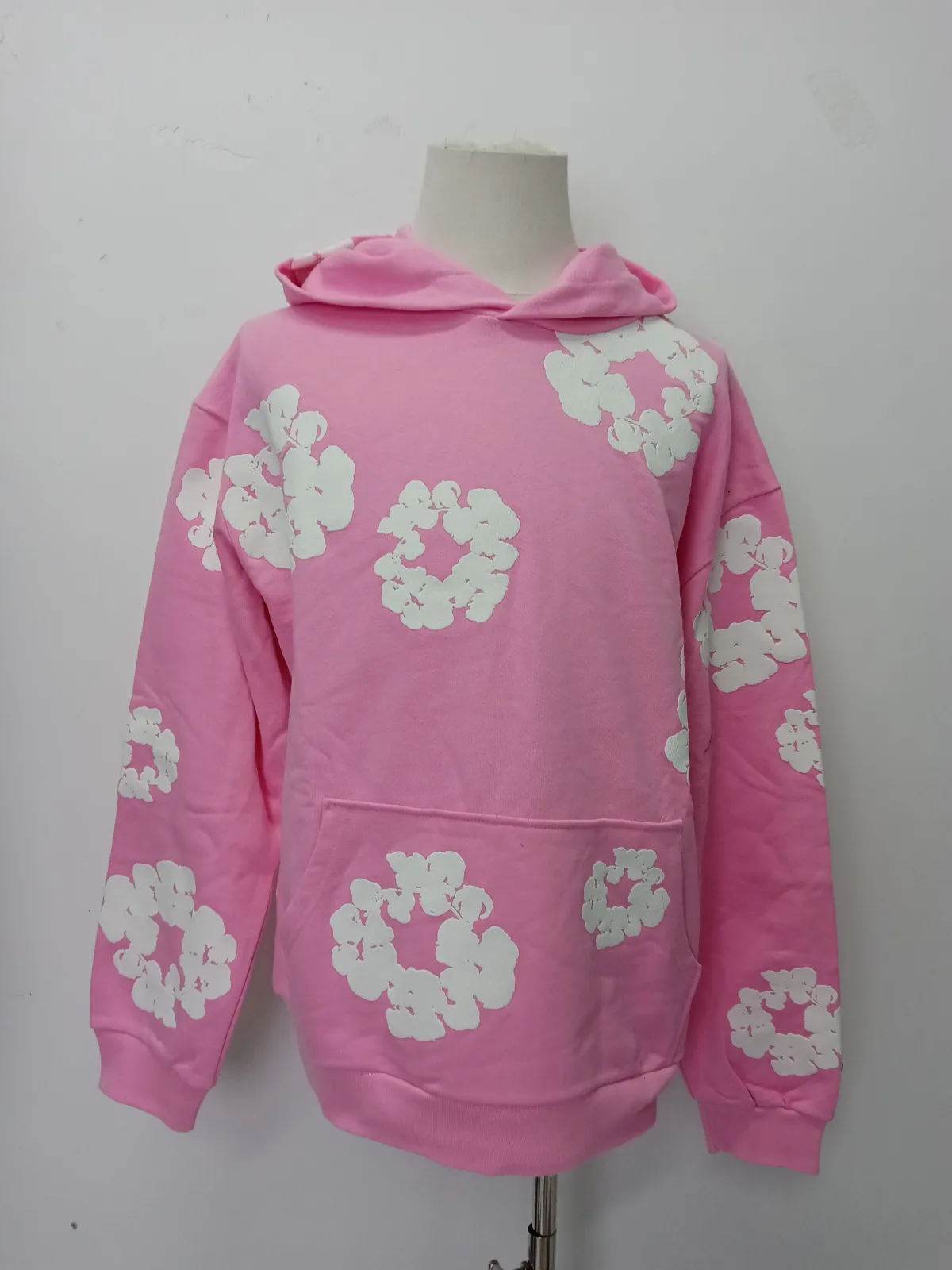QC photos of Denim Tears The Cotton Wreath Sweatshirt Pink reps showing detailed stitching and soft fabric quality. This fake denim tears sweatshirt is part of stockxkicks high-quality fake clothes co
