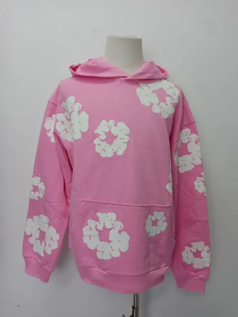 QC photos of Denim Tears The Cotton Wreath Sweatshirt Pink reps showing detailed stitching and soft fabric quality. This fake denim tears sweatshirt is part of stockxkicks high-quality fake clothes co