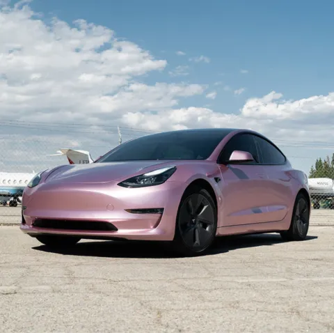 A Symphony of Innovation: Tesla Transformed with Custom Car Wraps