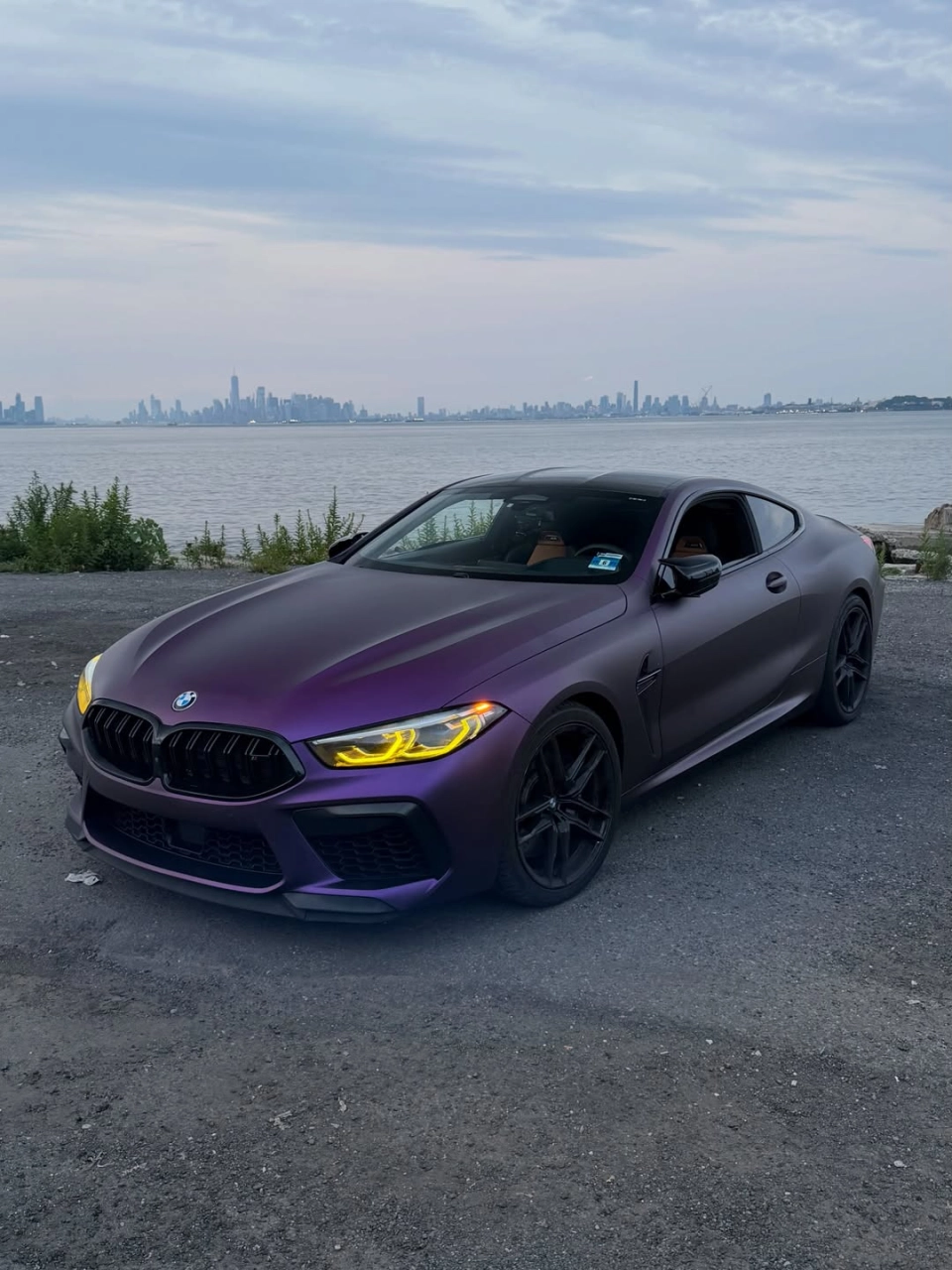 Matte Magic Purple Russian Violet Purple PET Wrap on BMW M8, waterfront outdoor shot