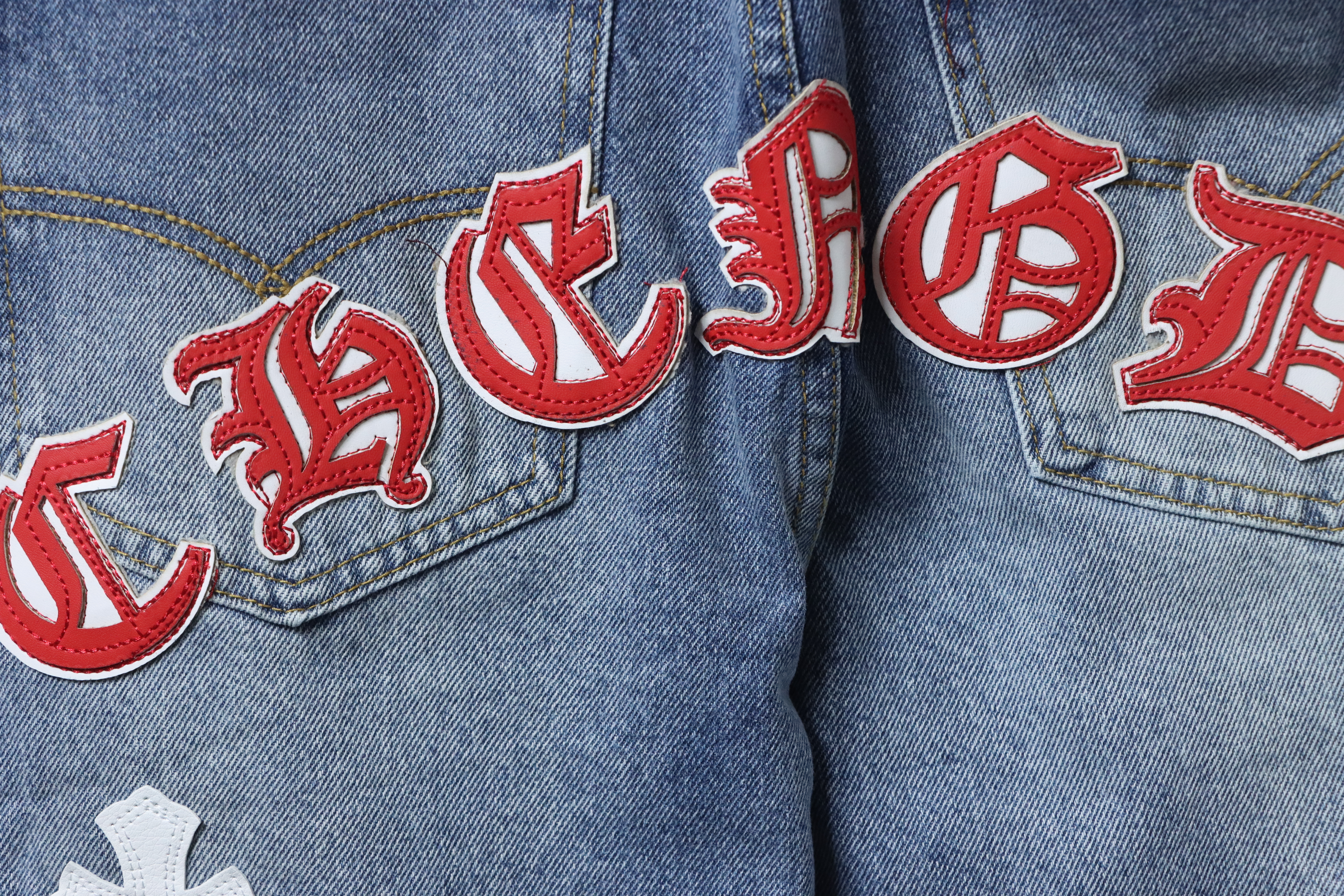 EM Sneakers Chrome Hearts Red and White Cross-patterned Jeans with Sanskrit on the Back