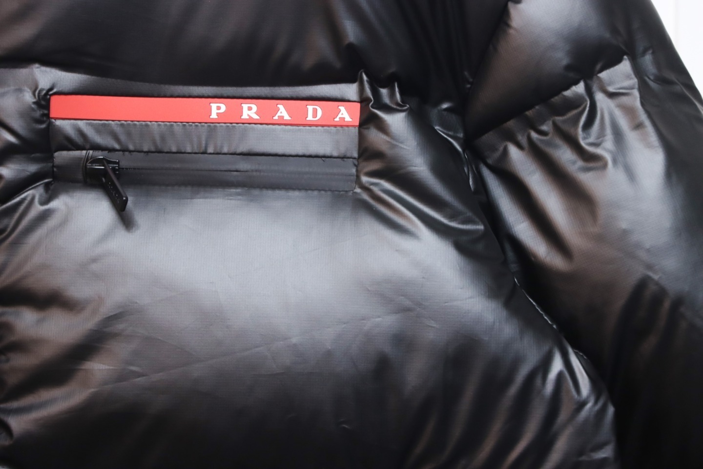 EM Sneakers Prada Red Stripe Logo Down Jacket Black