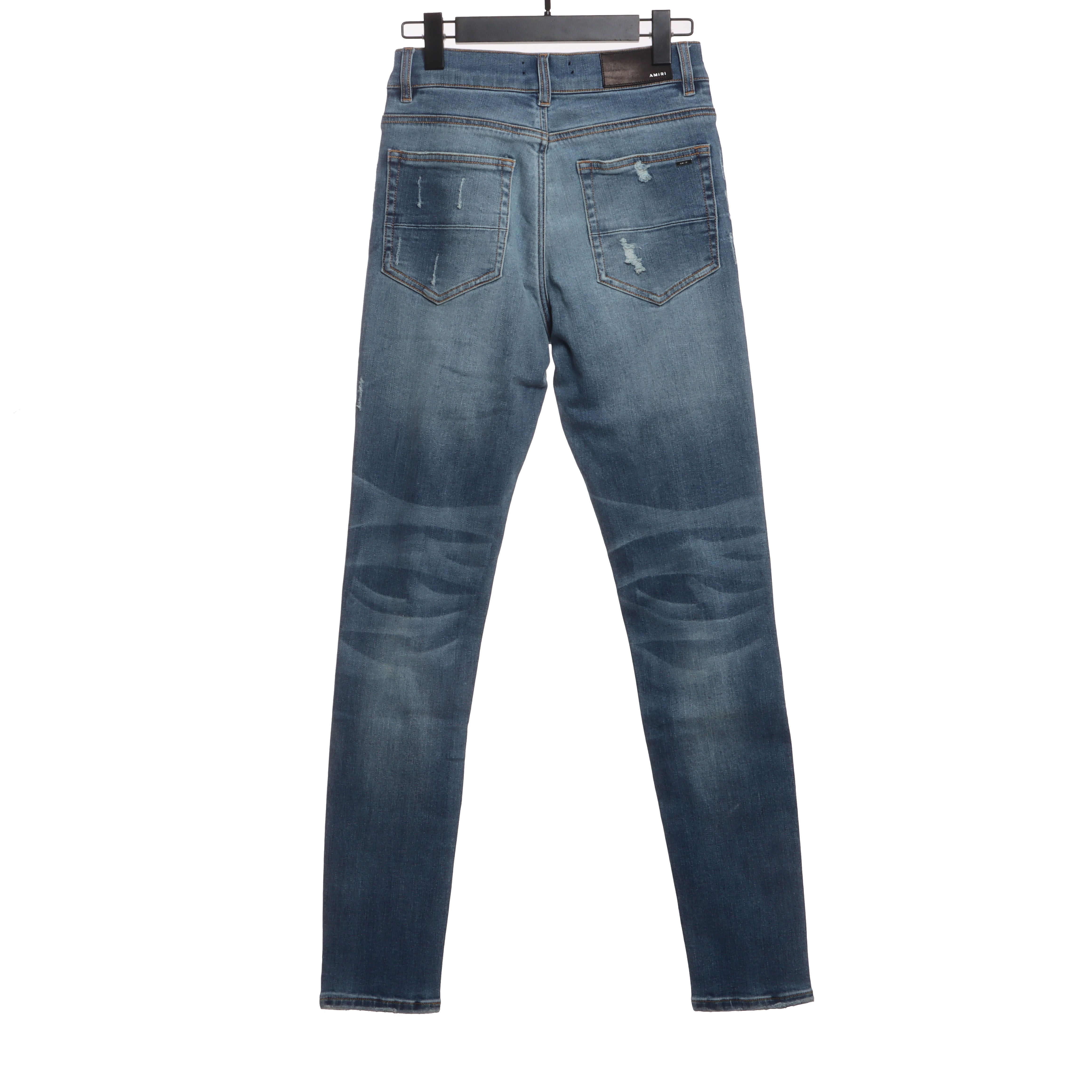     AMIRI Washed blue ripped jeans