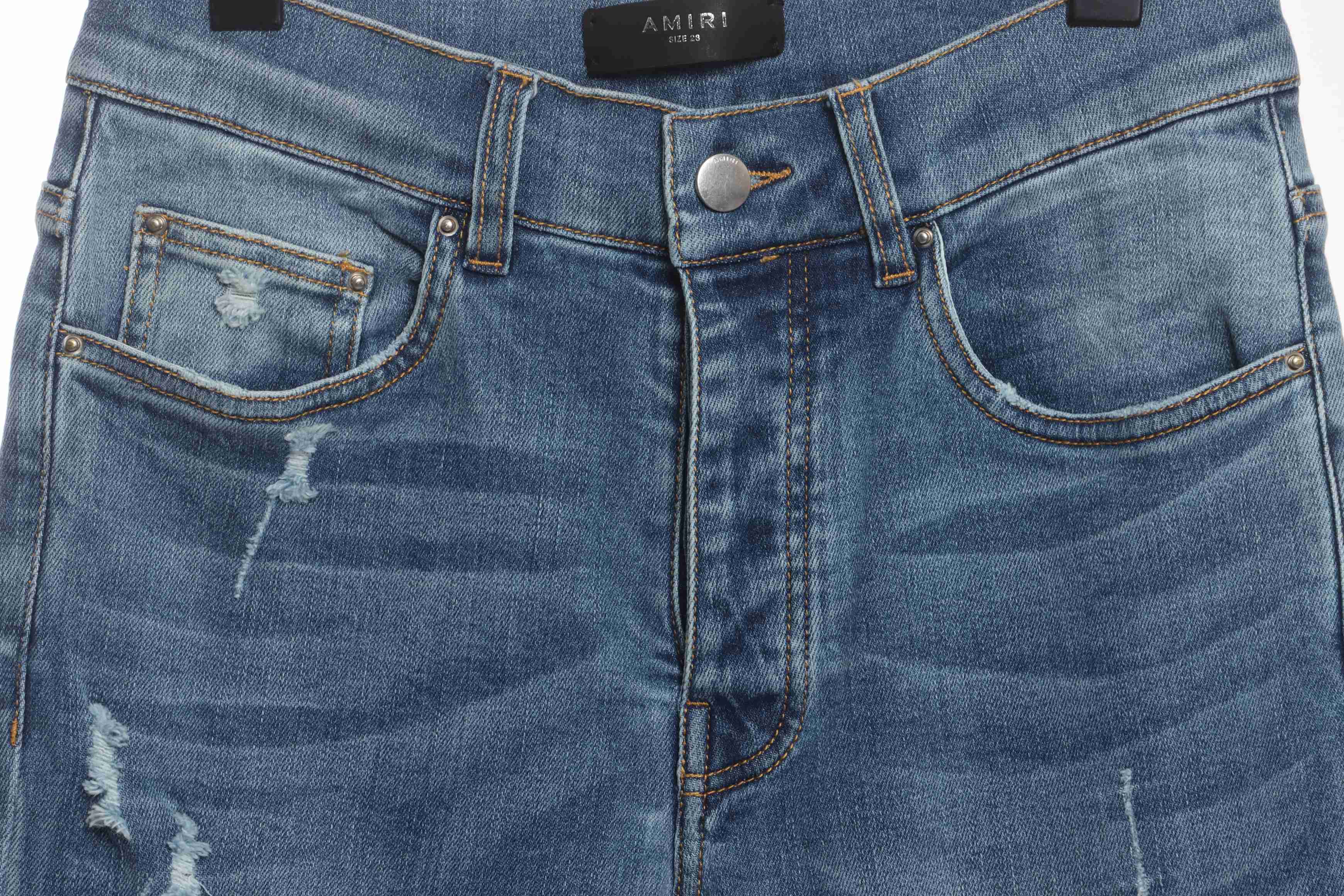    AMIRI Washed blue ripped jeans