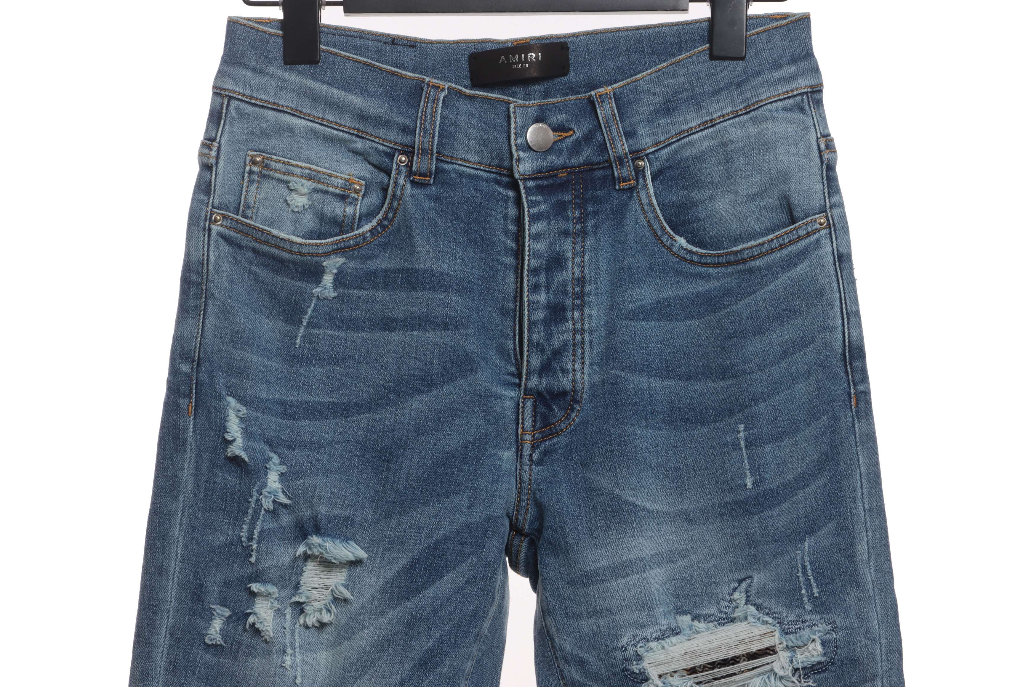     AMIRI Washed blue ripped jeans