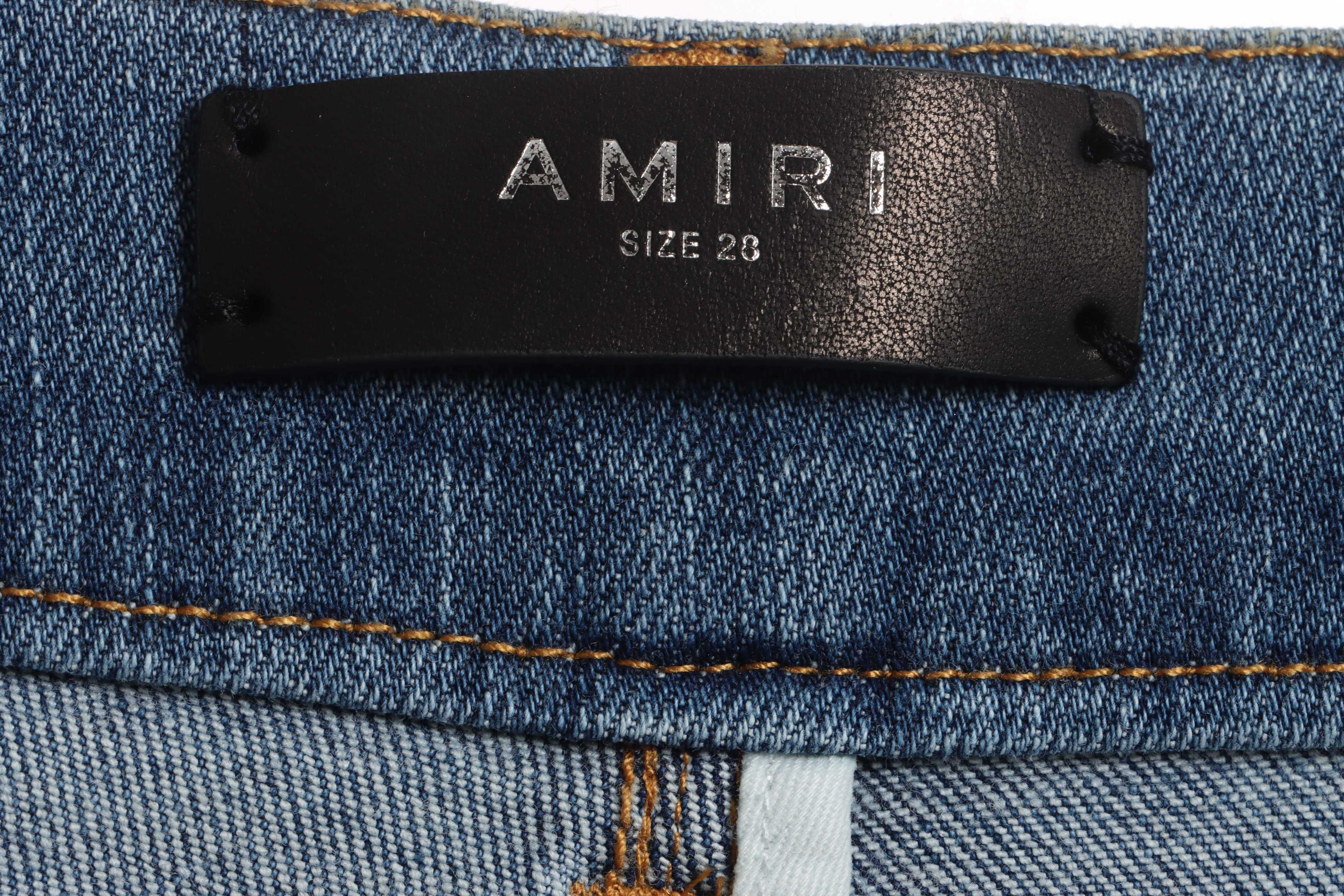     AMIRI Washed blue ripped jeans