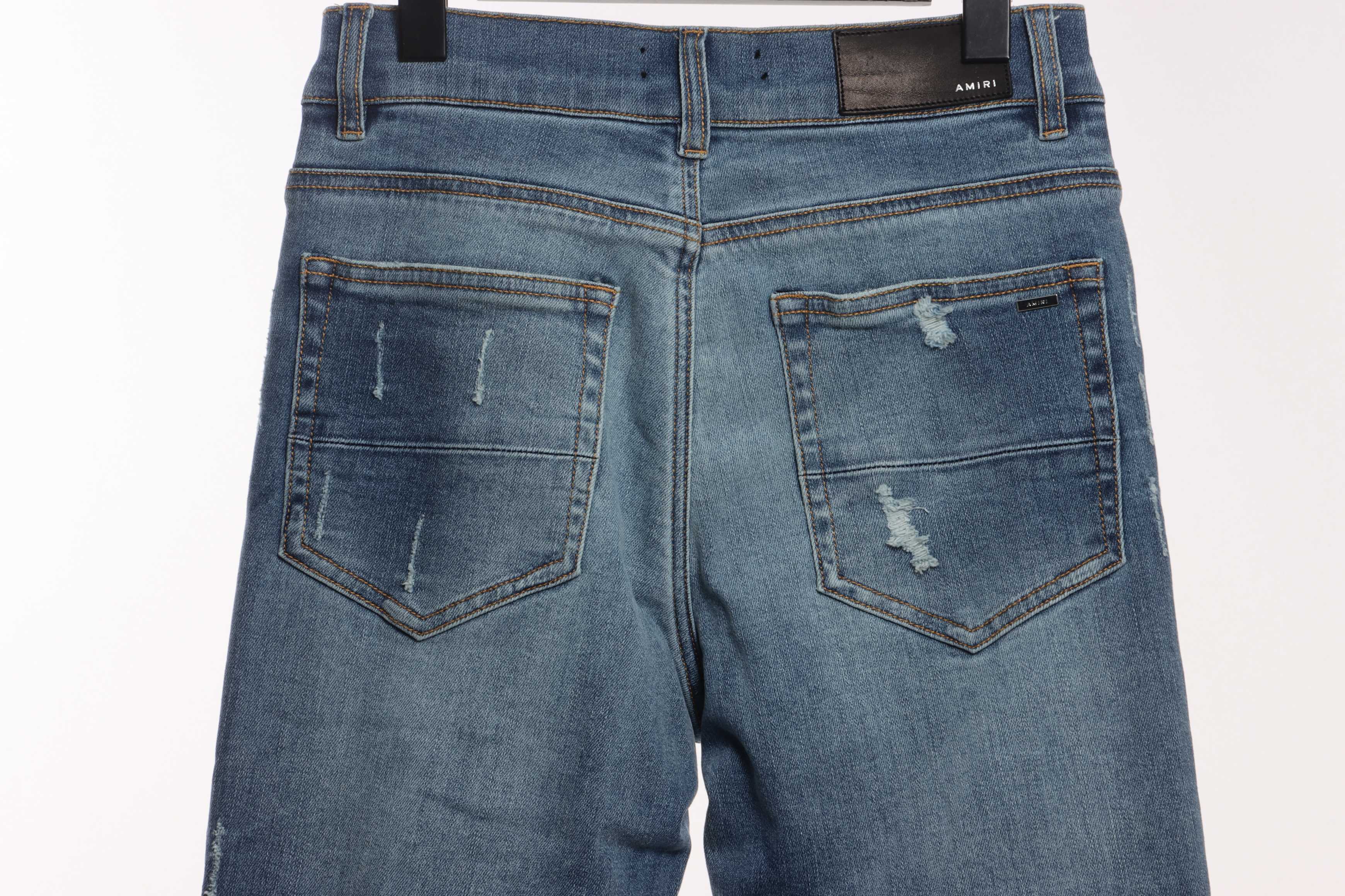     AMIRI Washed blue ripped jeans