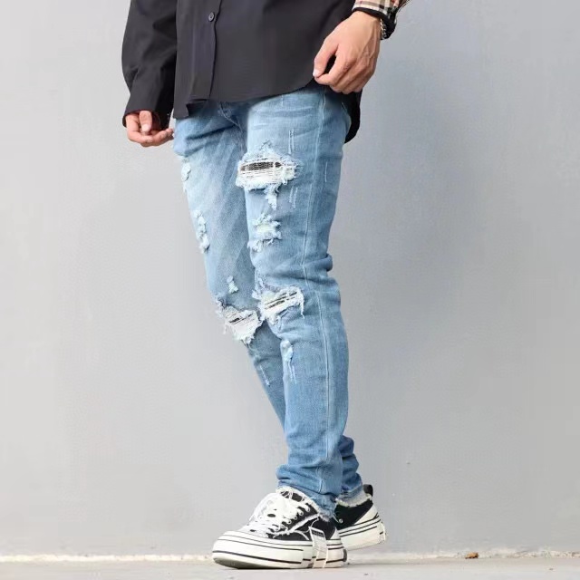     AMIRI Washed blue ripped jeans