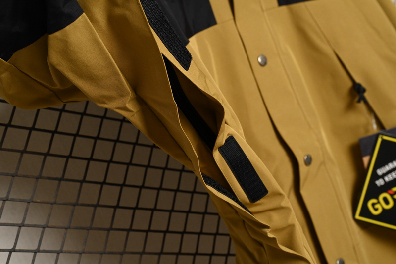 the Nor*h face black and khaki jackets