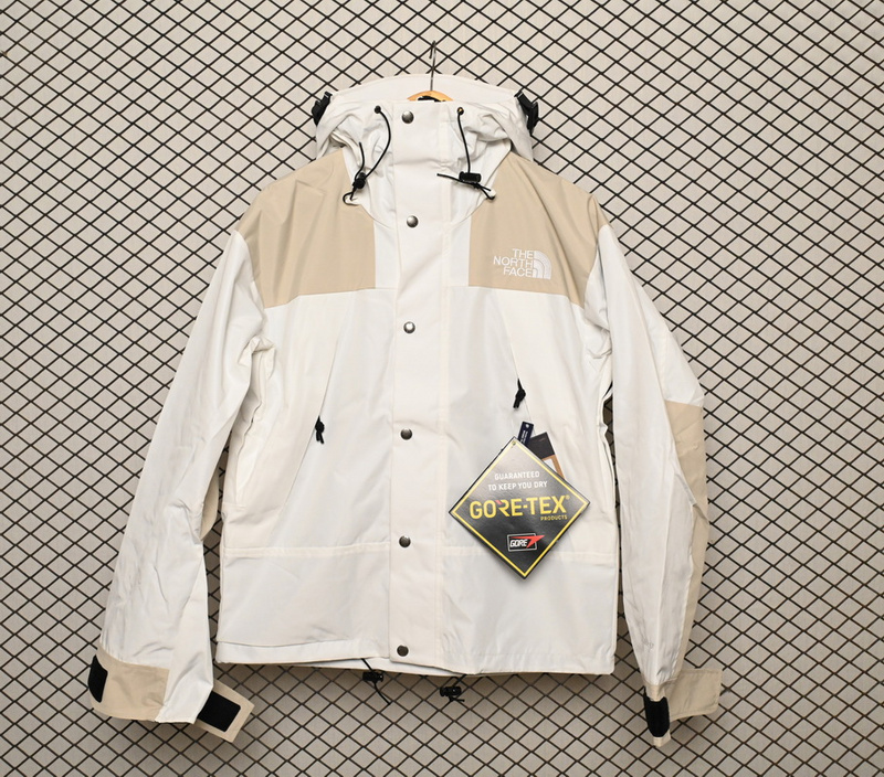 the Nor*h face black and milk white color matching jackets