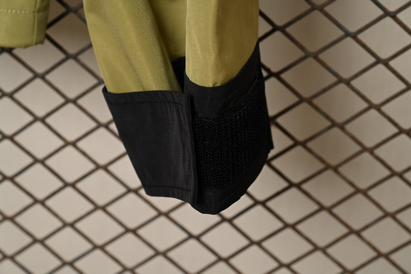 the Nor*h face black and mustard green jackets