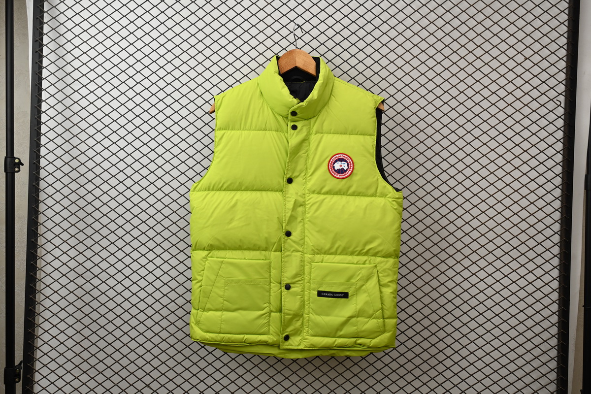 Can*a Go*e outdoor sports down vest navy fluorescent green