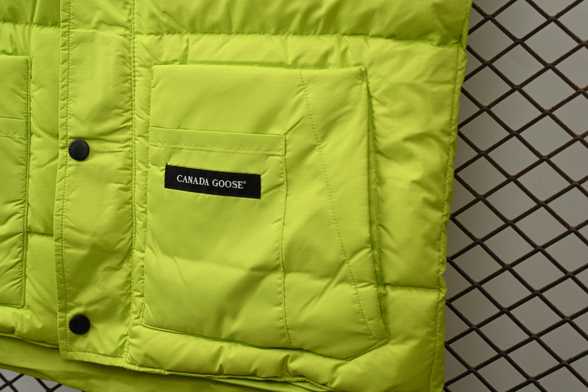 Can*a Go*e outdoor sports down vest navy fluorescent green