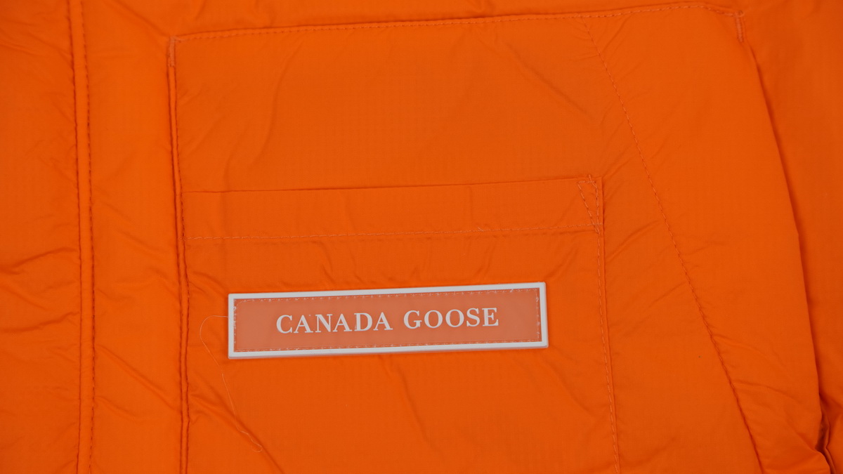Can*a Go*e outdoor sports down vest orange