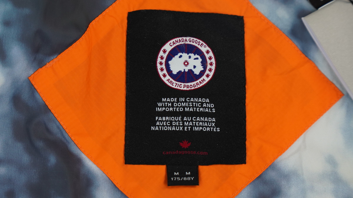 Can*a Go*e outdoor sports down vest orange