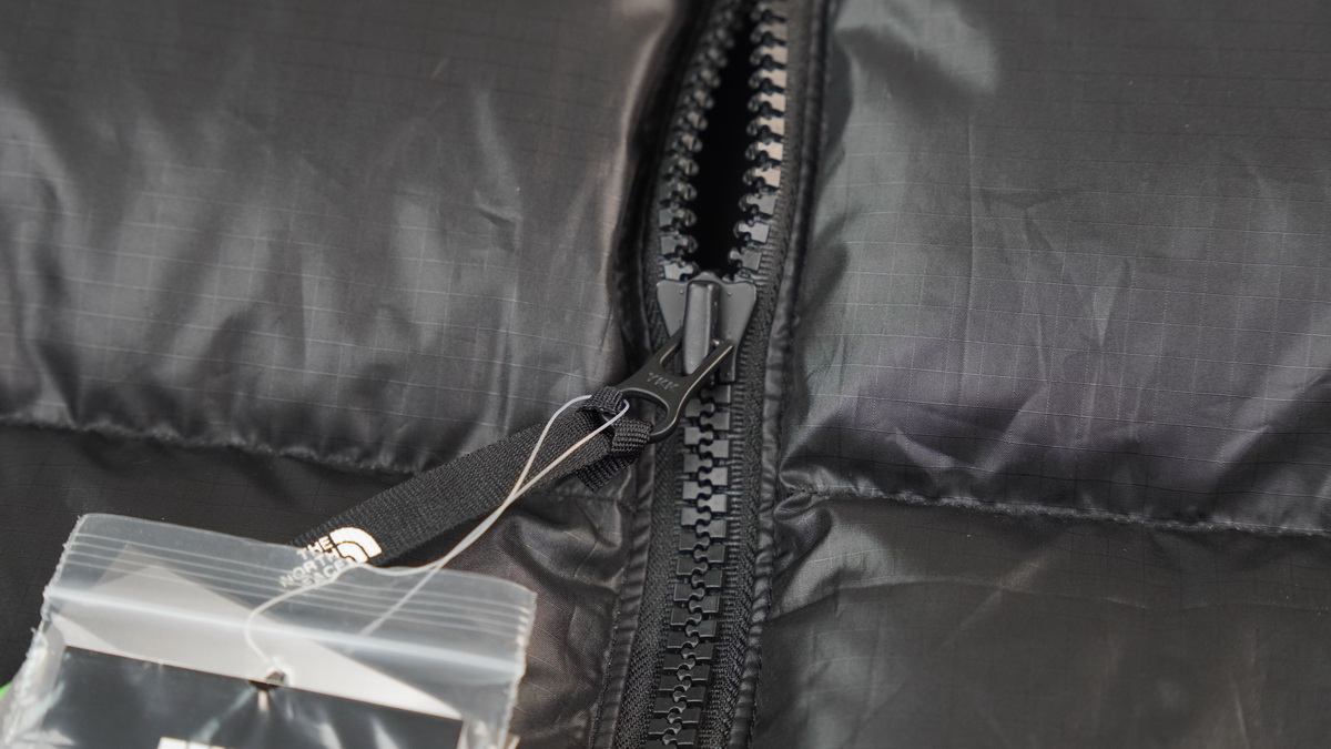 the n0*h F**e splicing white and black down jacket