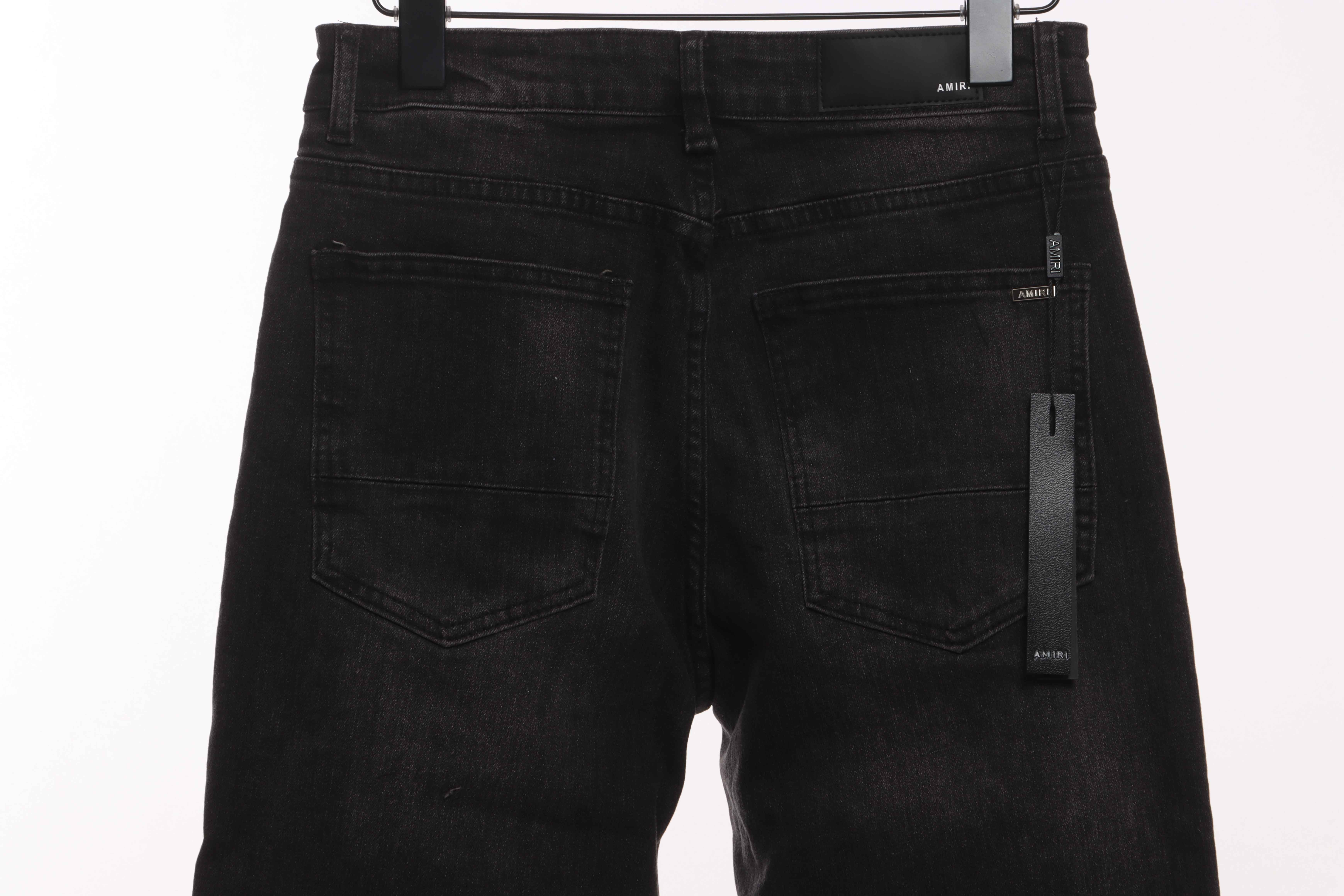 AMIRI Pink Ripped Jeans