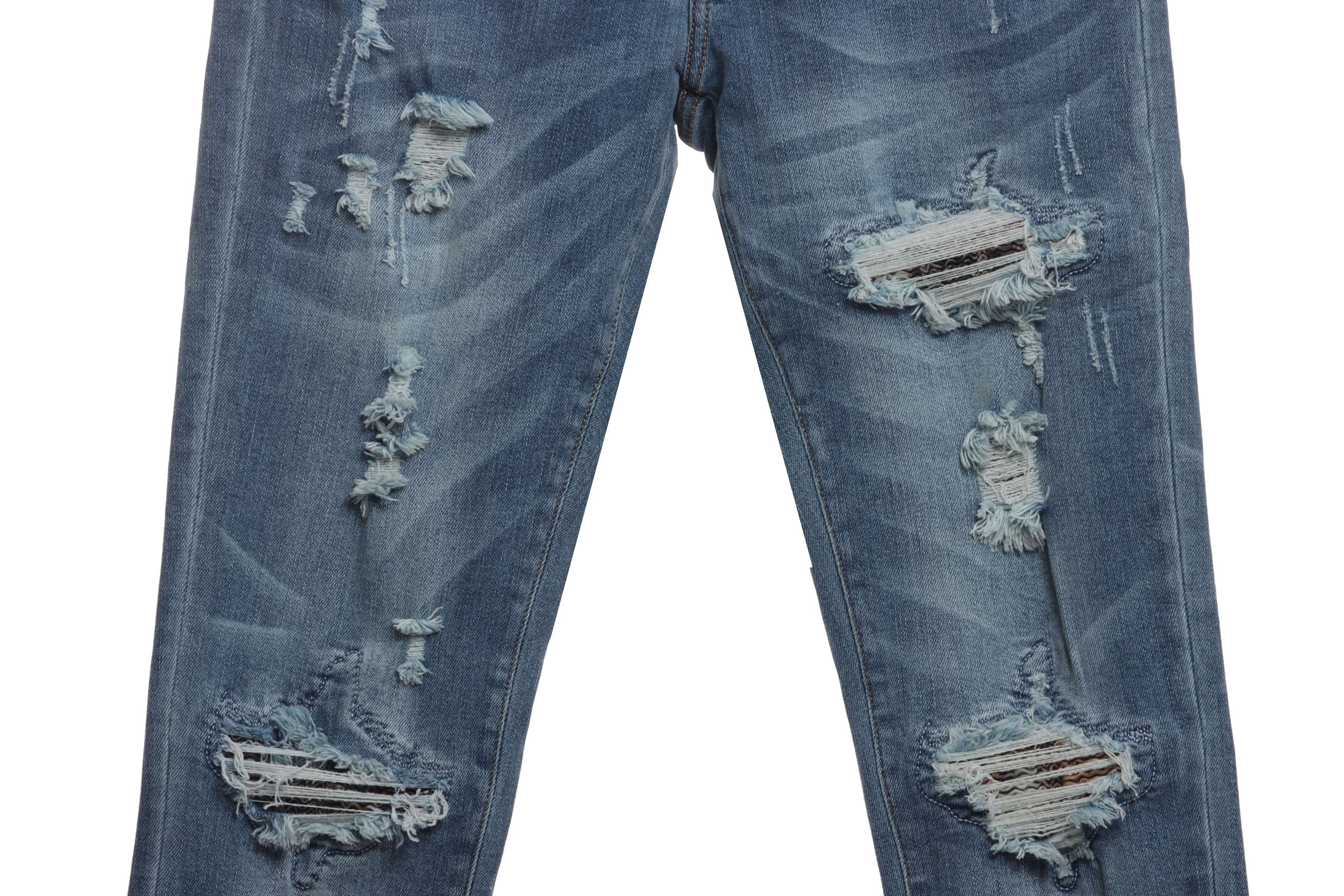 AMIRI Washed Blue Ripped Jeans
