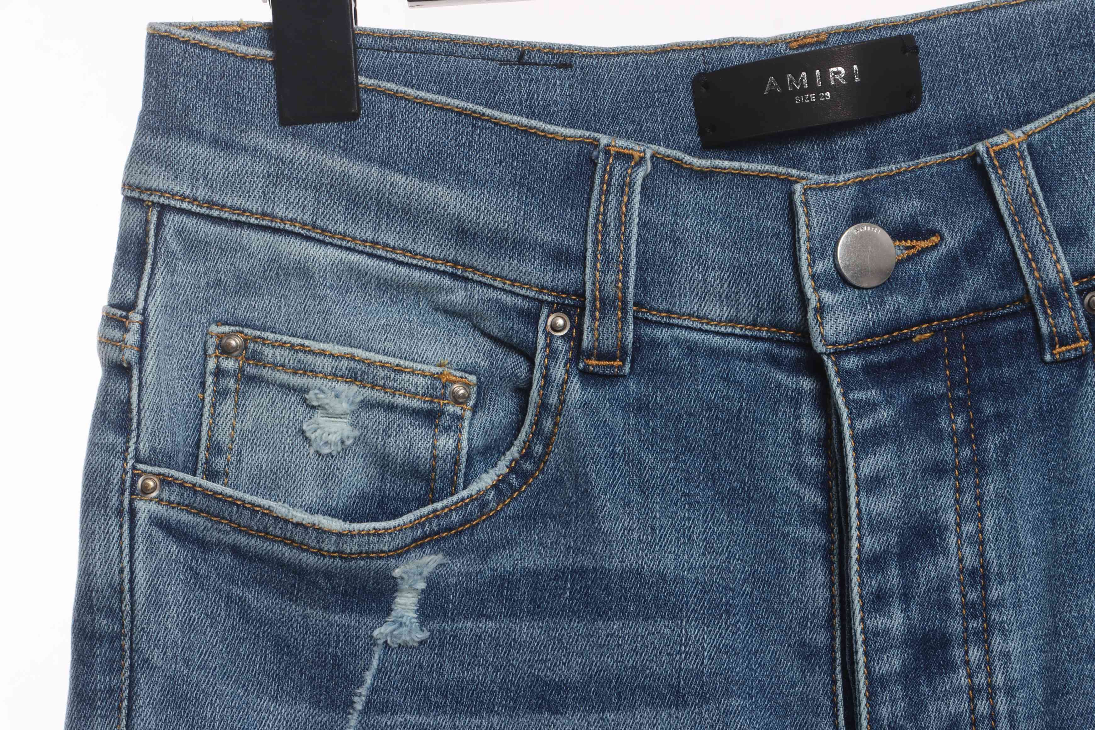 AMIRI Washed Blue Ripped Jeans