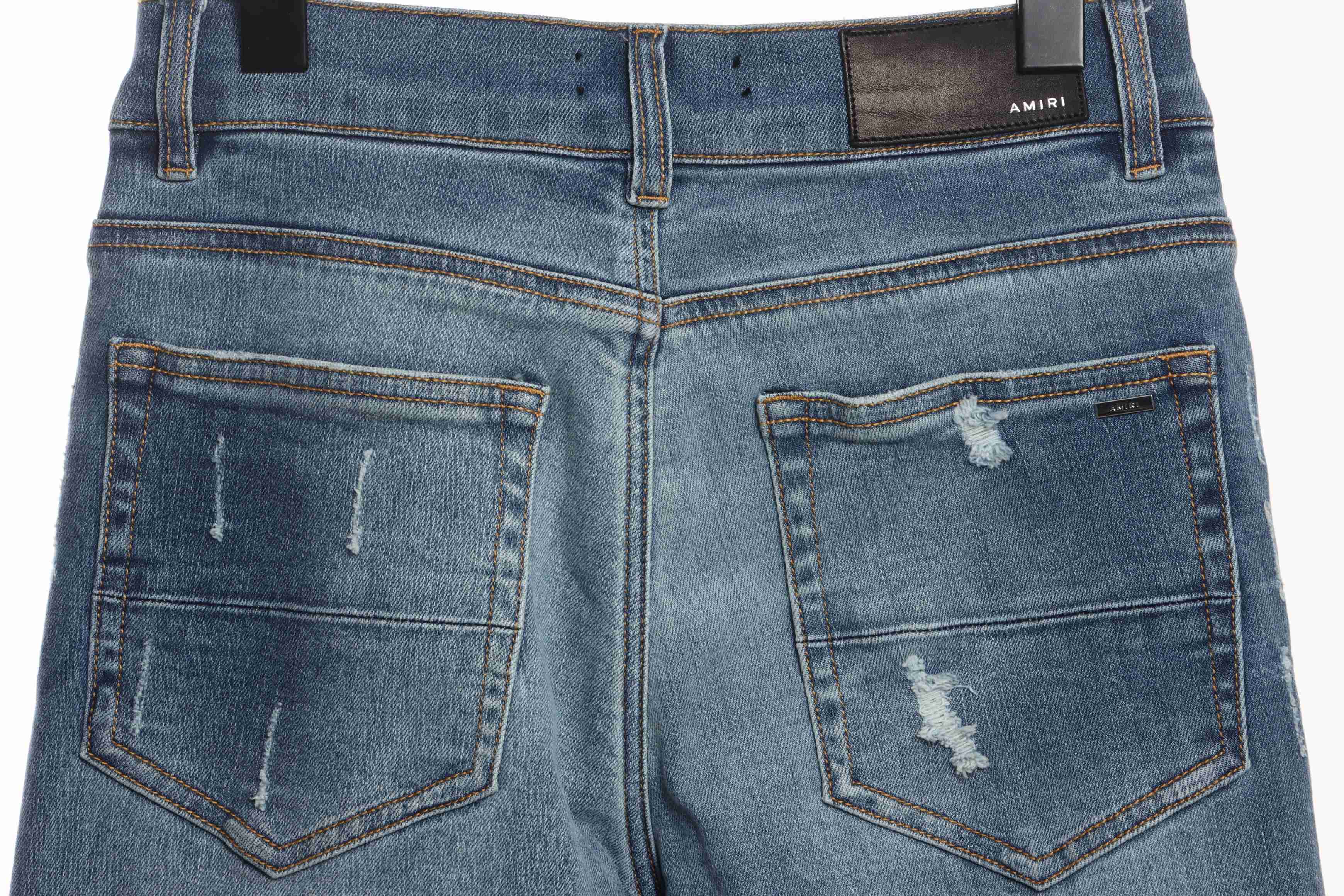 AMIRI Washed Blue Ripped Jeans