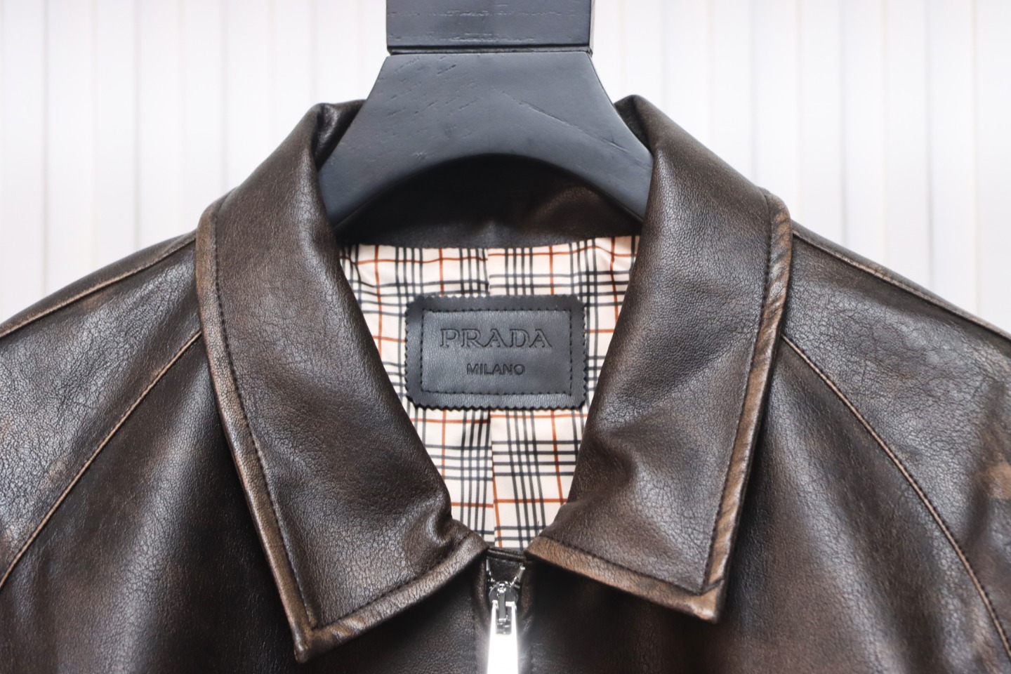 Prada Distressed Leather Jacket With Triangle Logo On Back