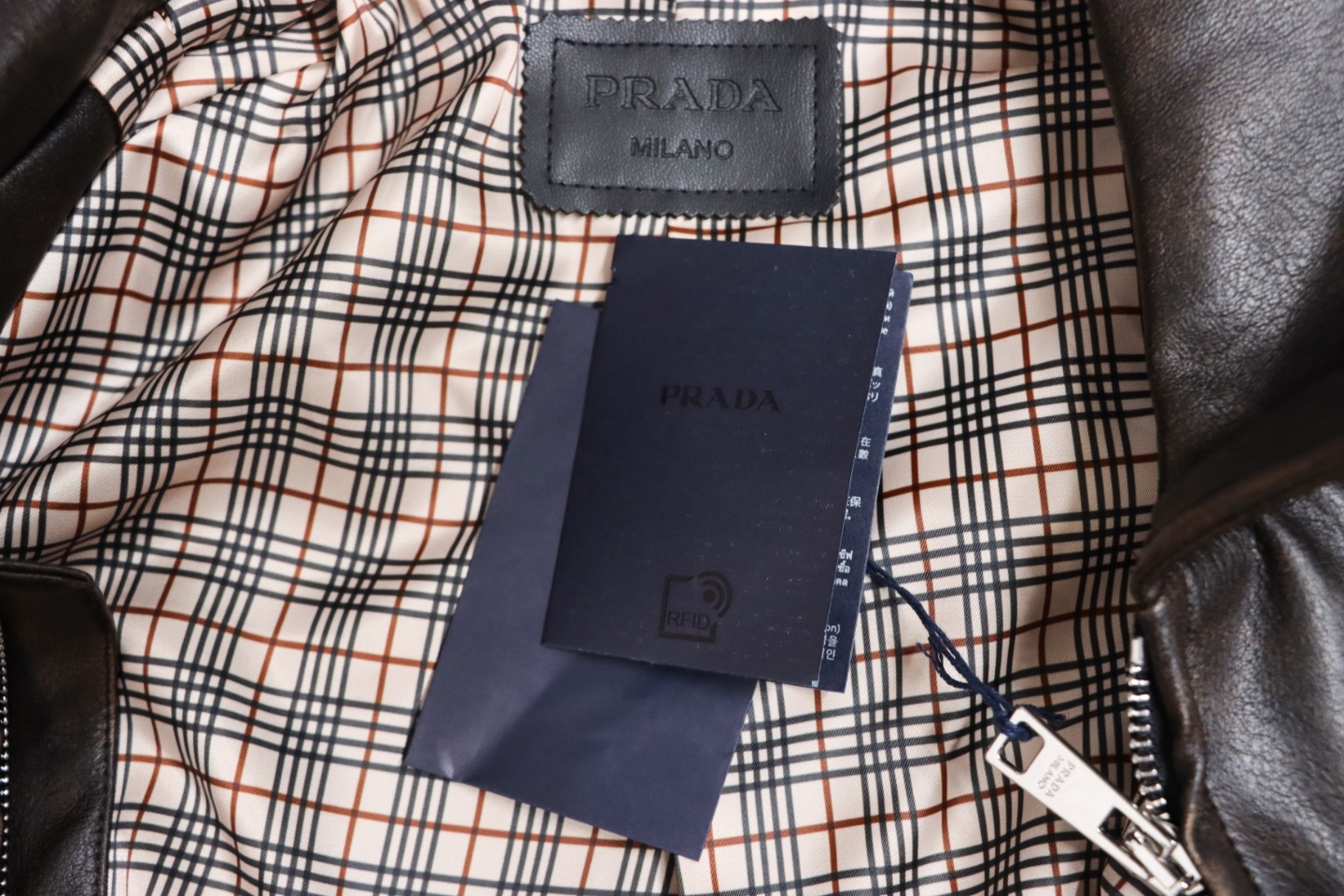 Prada Distressed Leather Jacket With Triangle Logo On Back