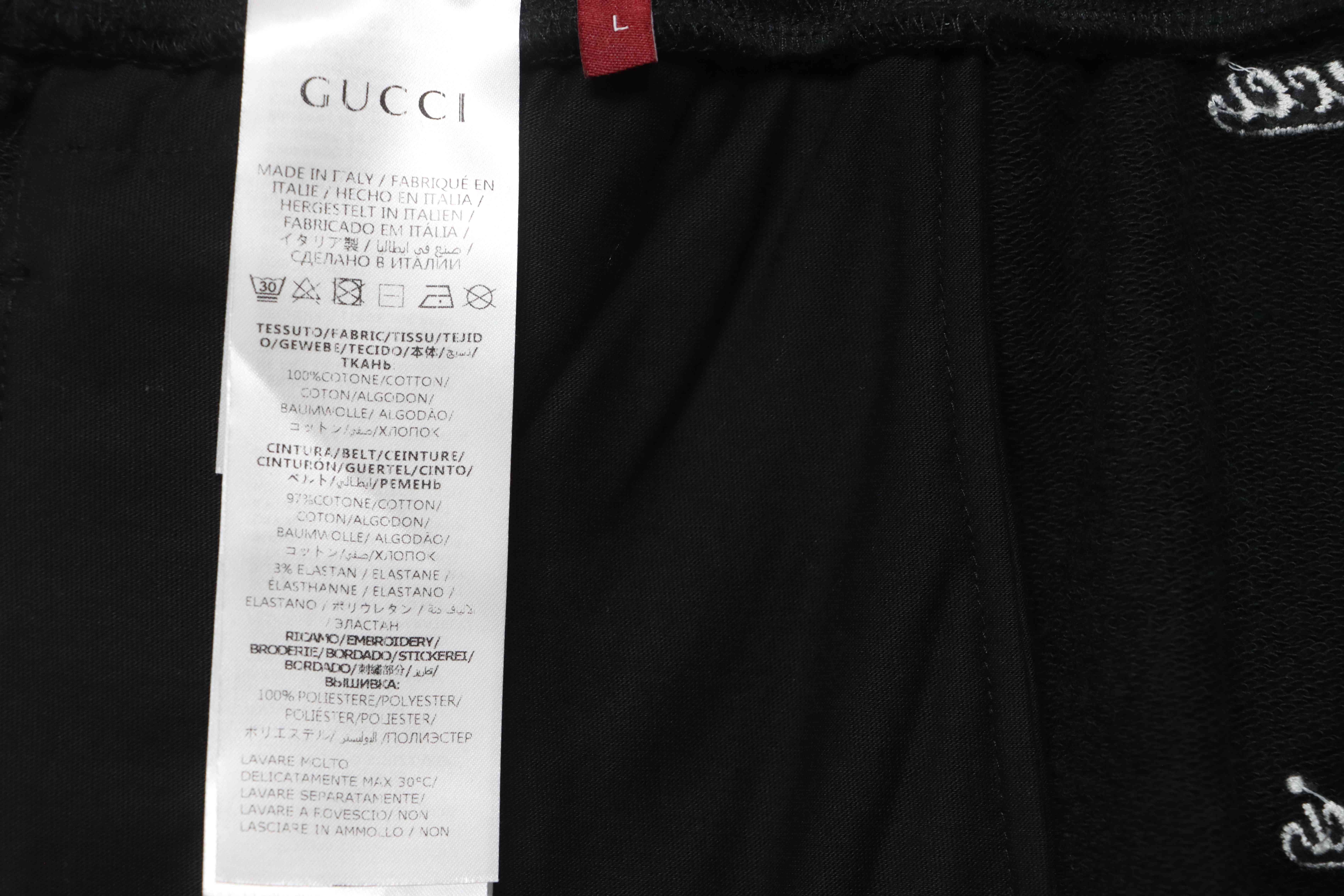Gucci all over embroidered logo shorts black