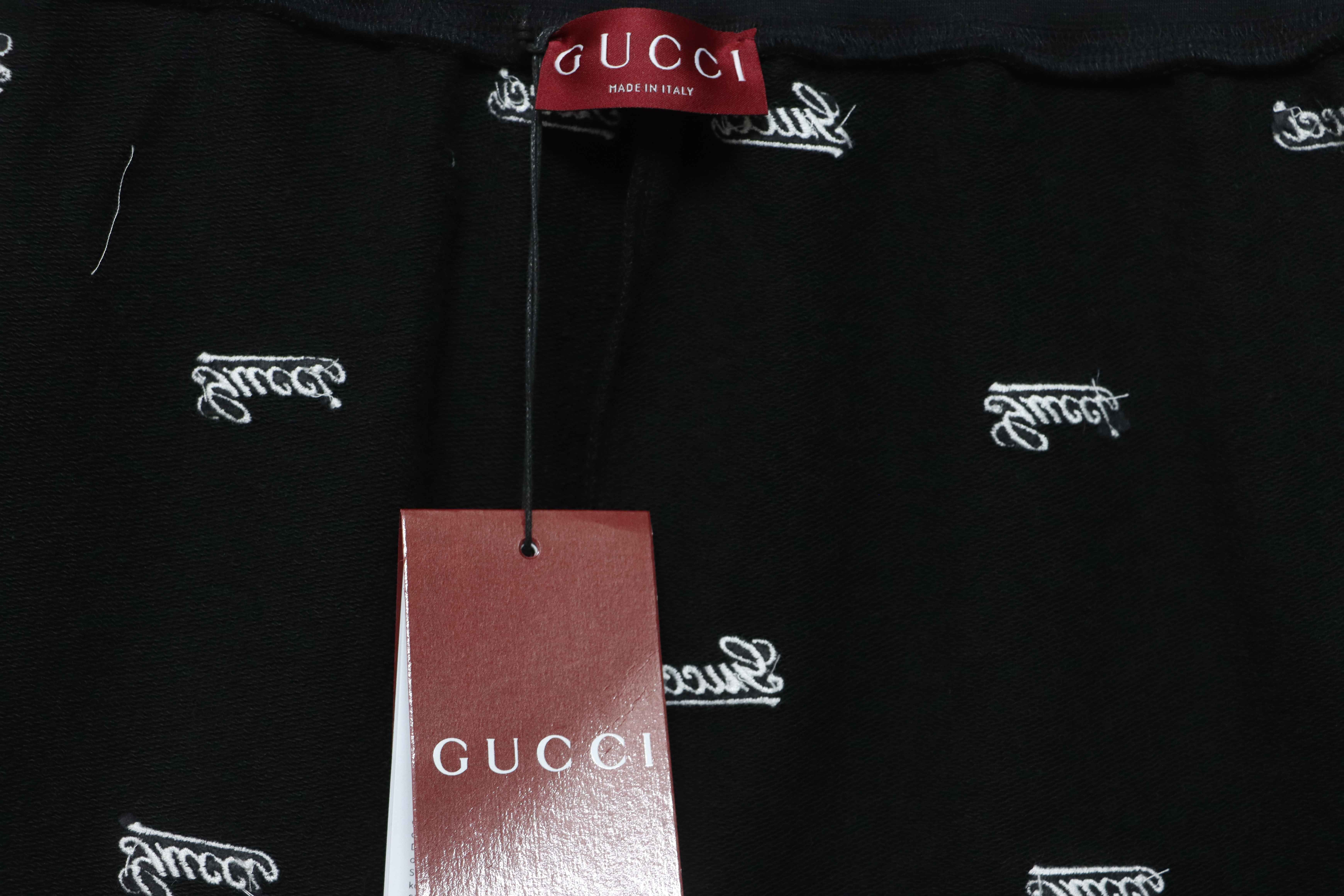 Gucci all over embroidered logo shorts black
