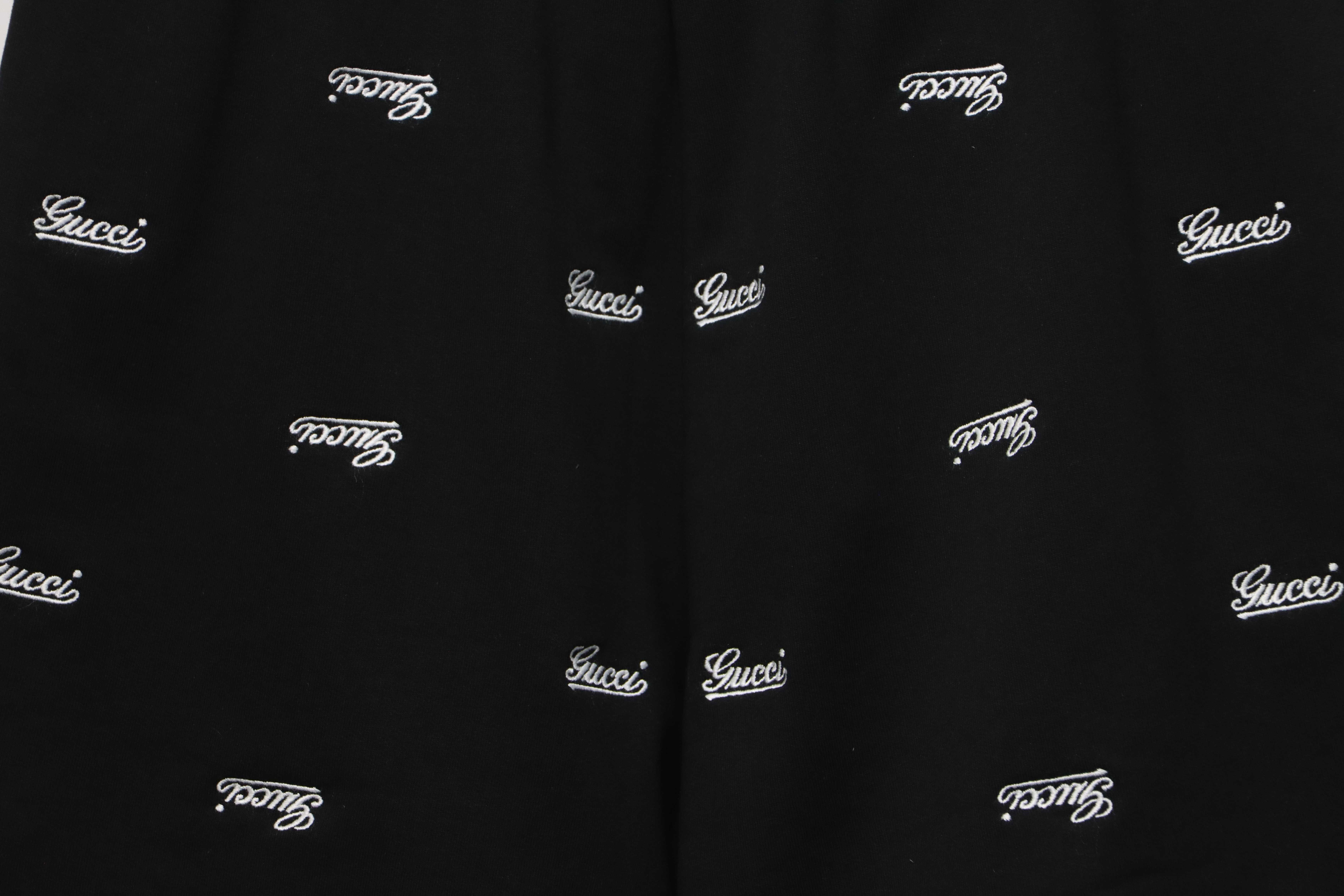 Gucci all over embroidered logo shorts black