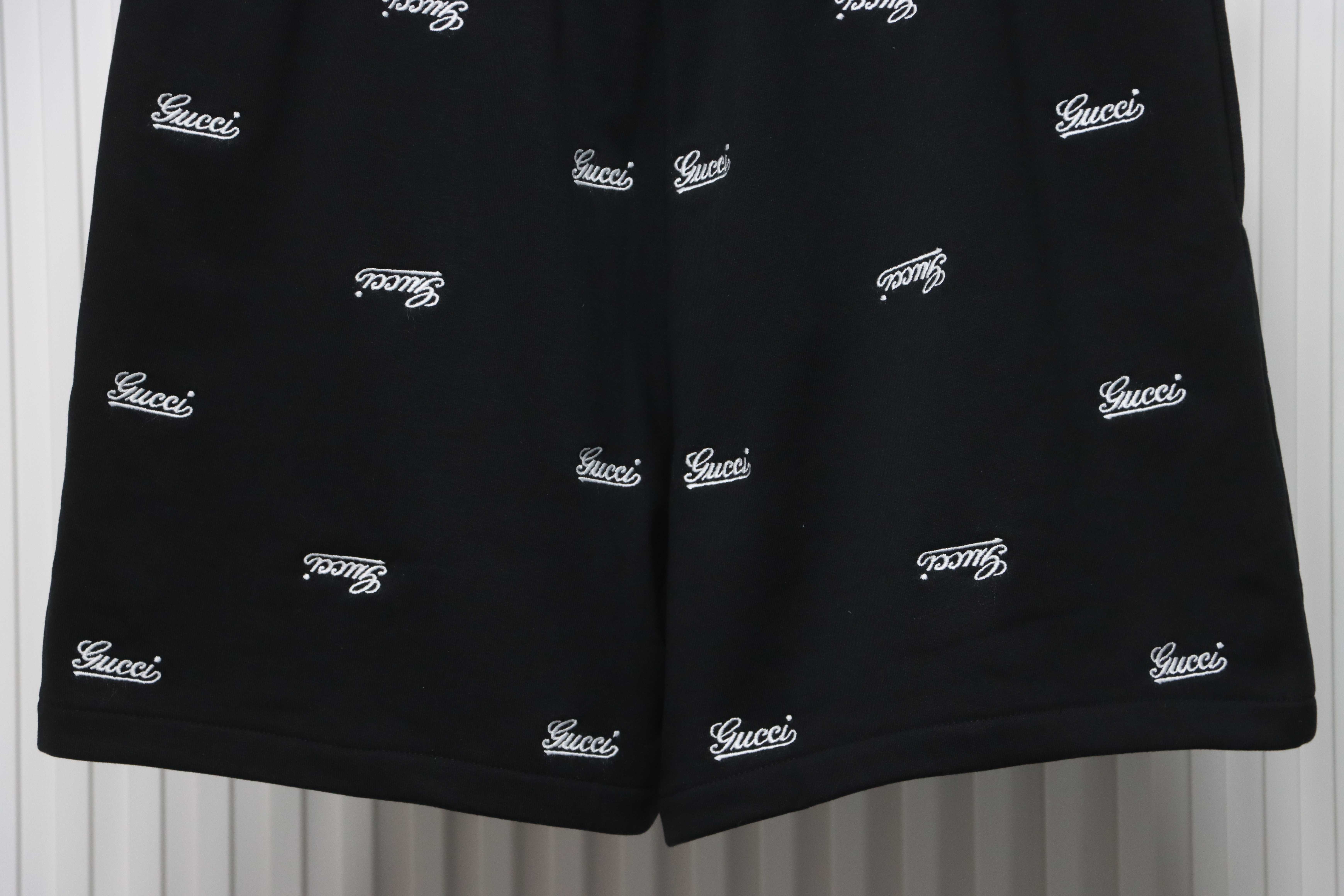 Gucci all over embroidered logo shorts black