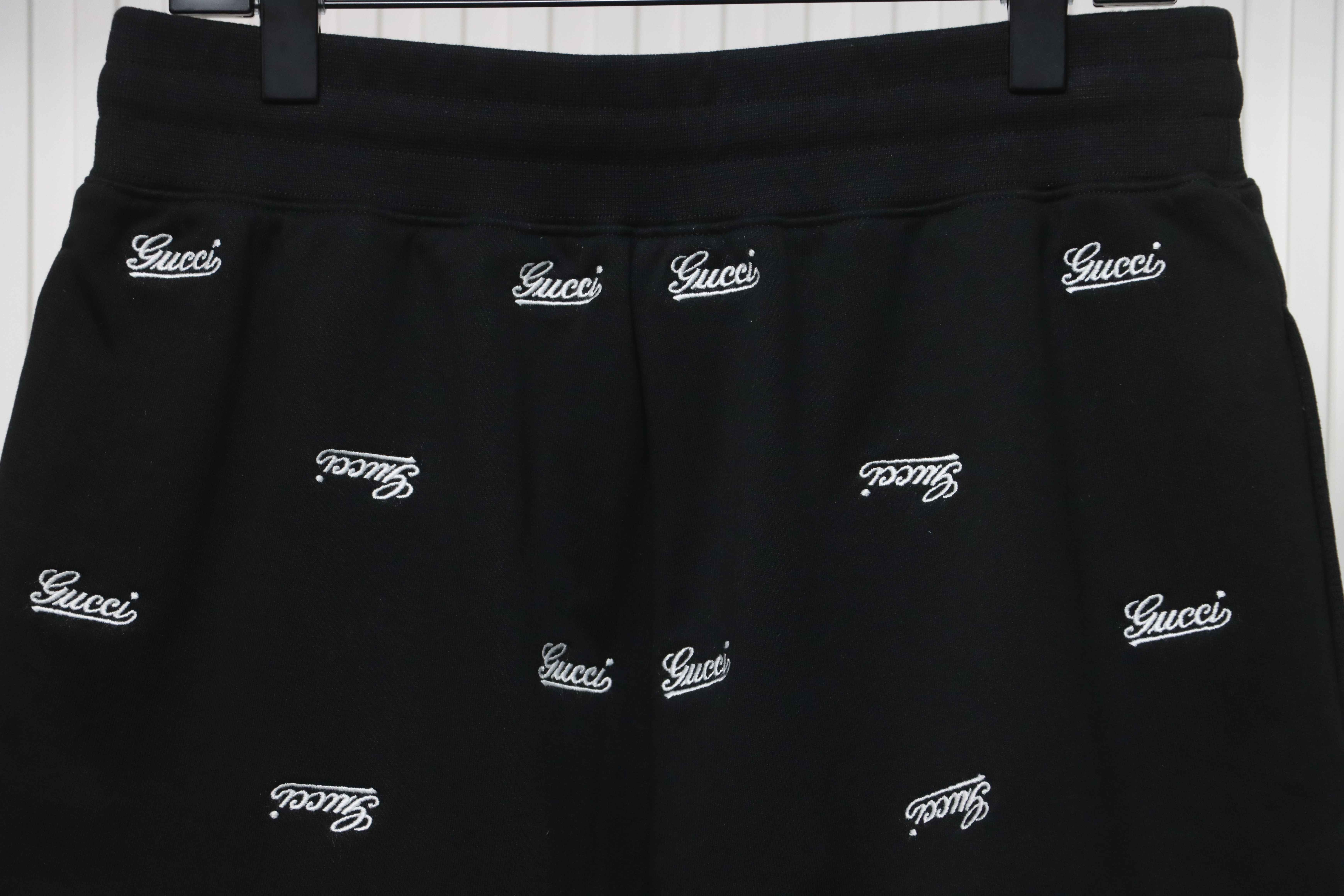 Gucci all over embroidered logo shorts black