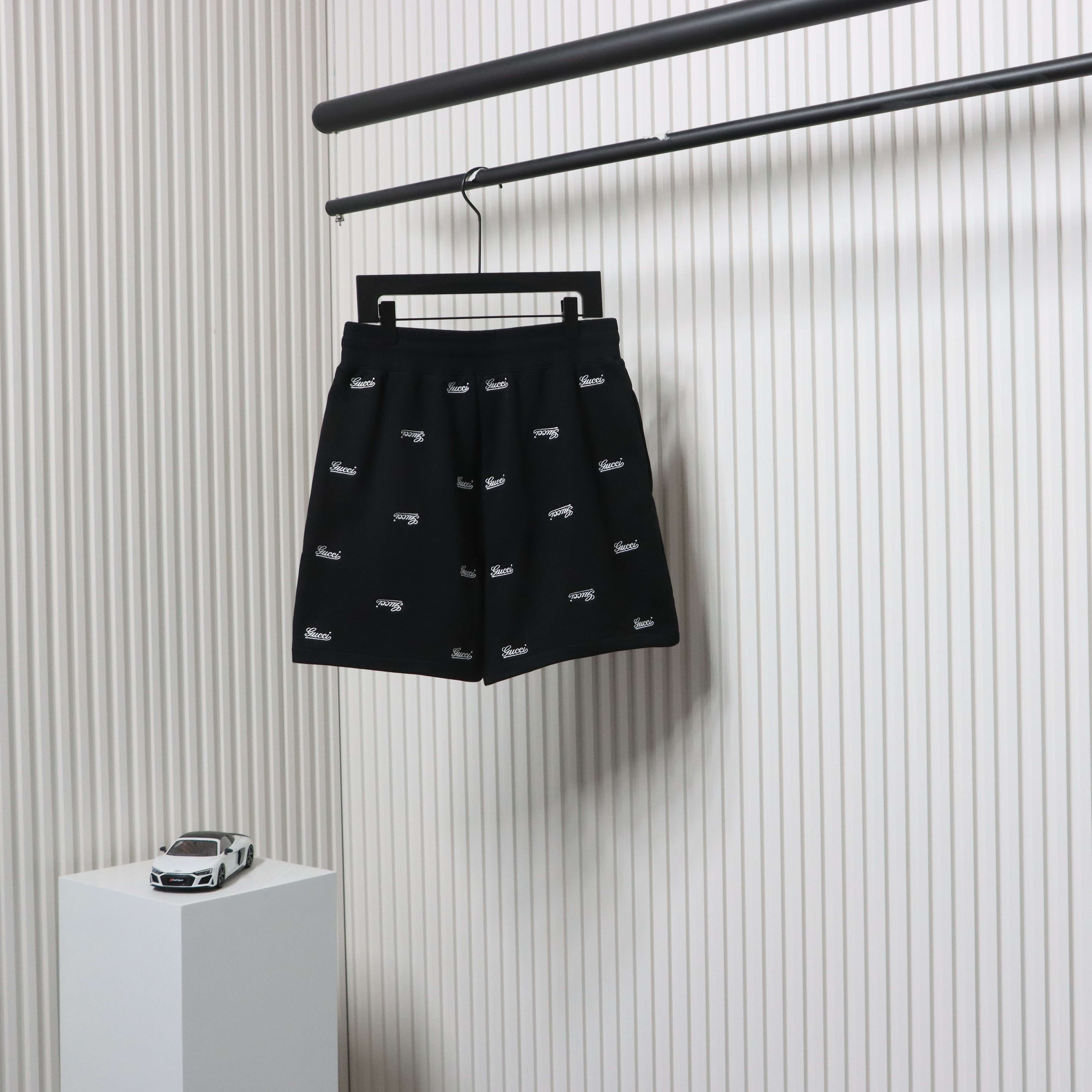Gucci all over embroidered logo shorts black