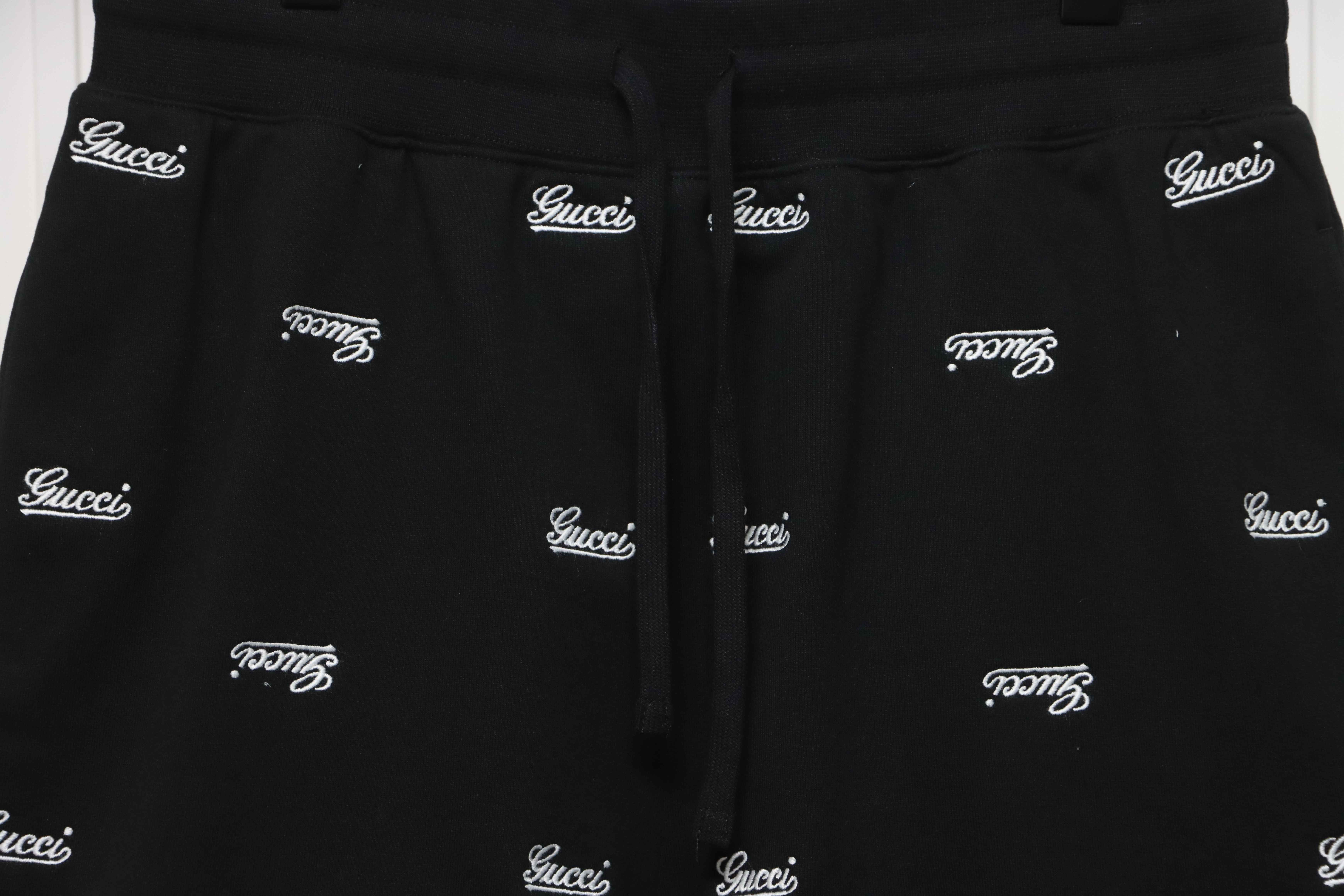 Gucci all over embroidered logo shorts black