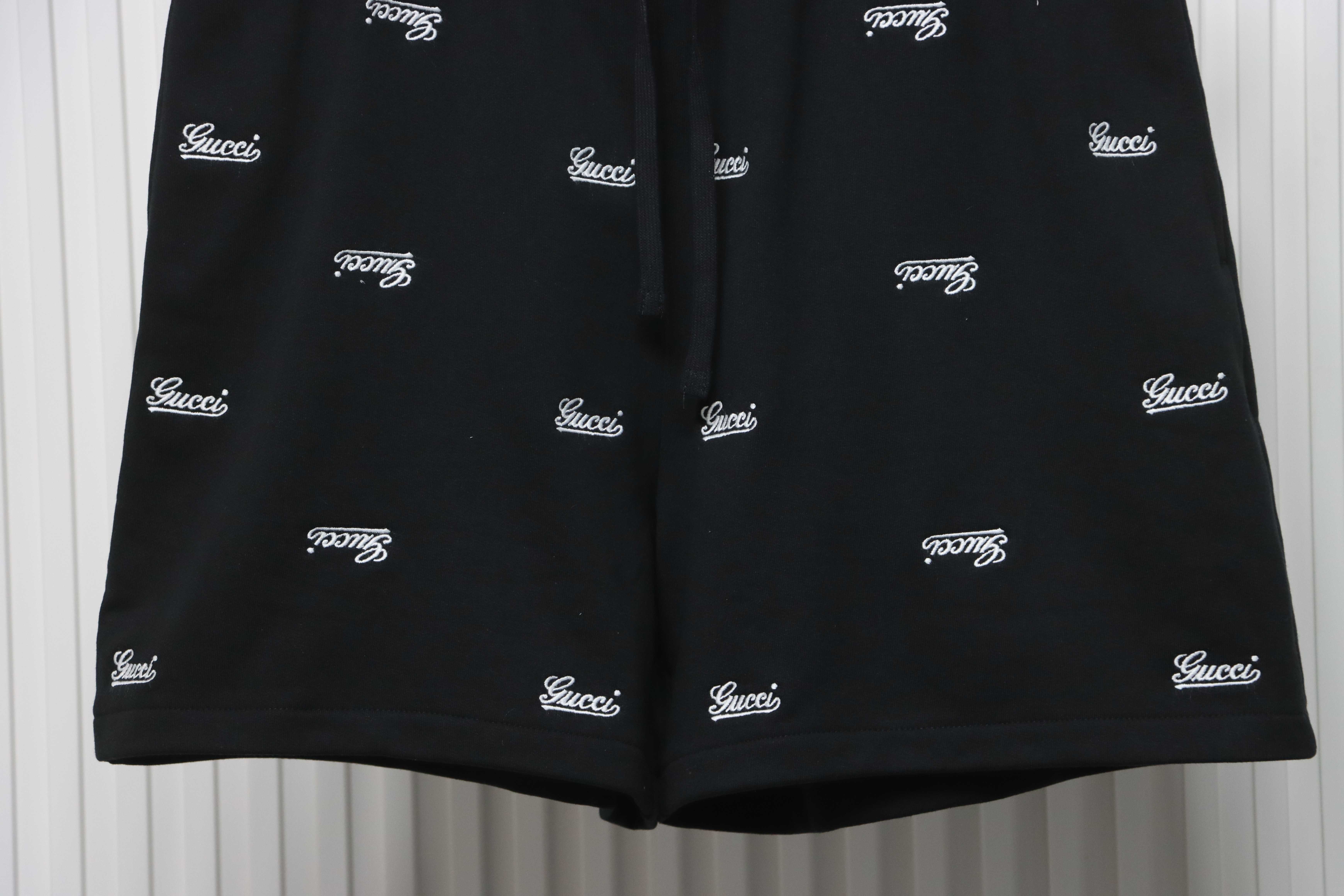 Gucci all over embroidered logo shorts black