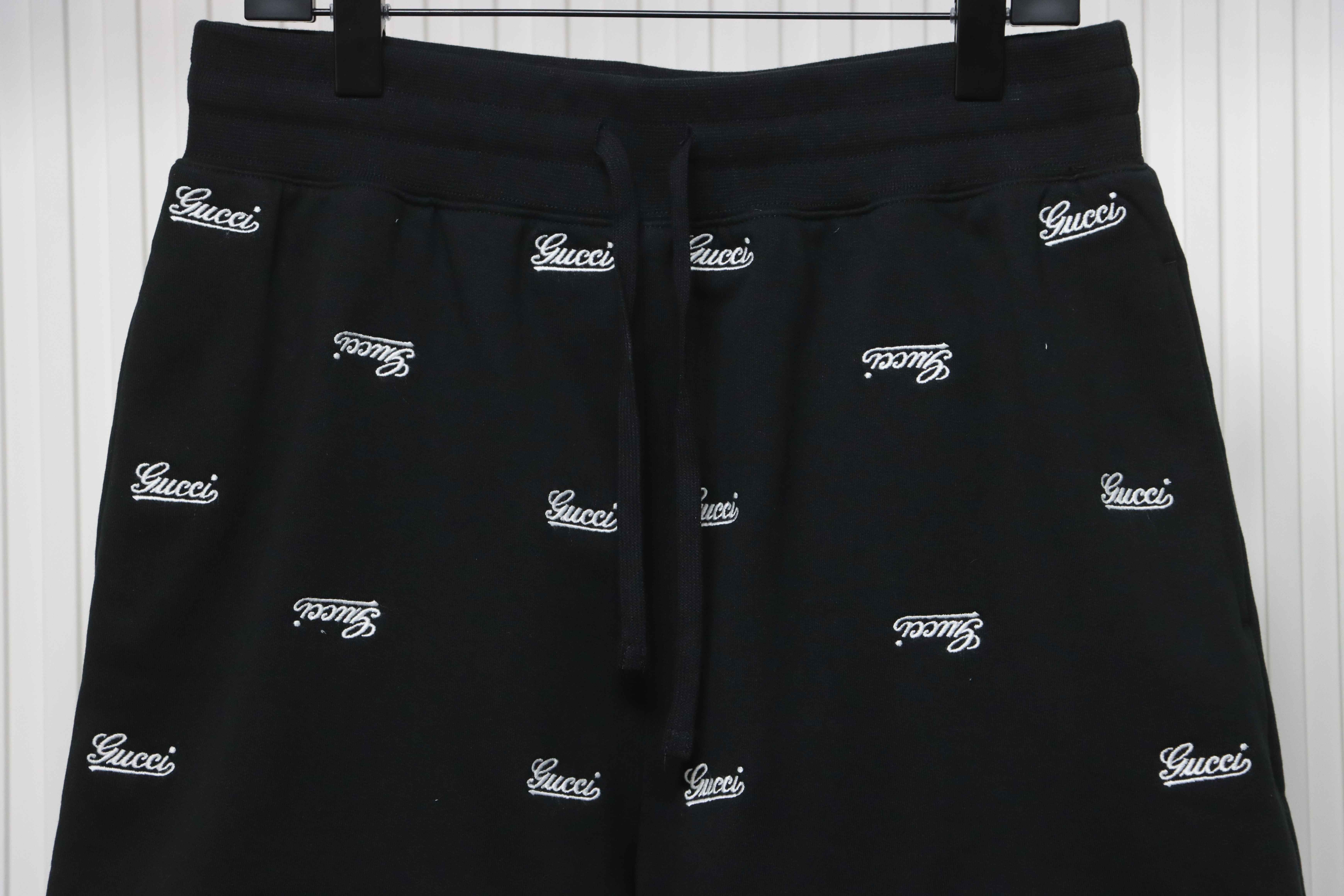 Gucci all over embroidered logo shorts black