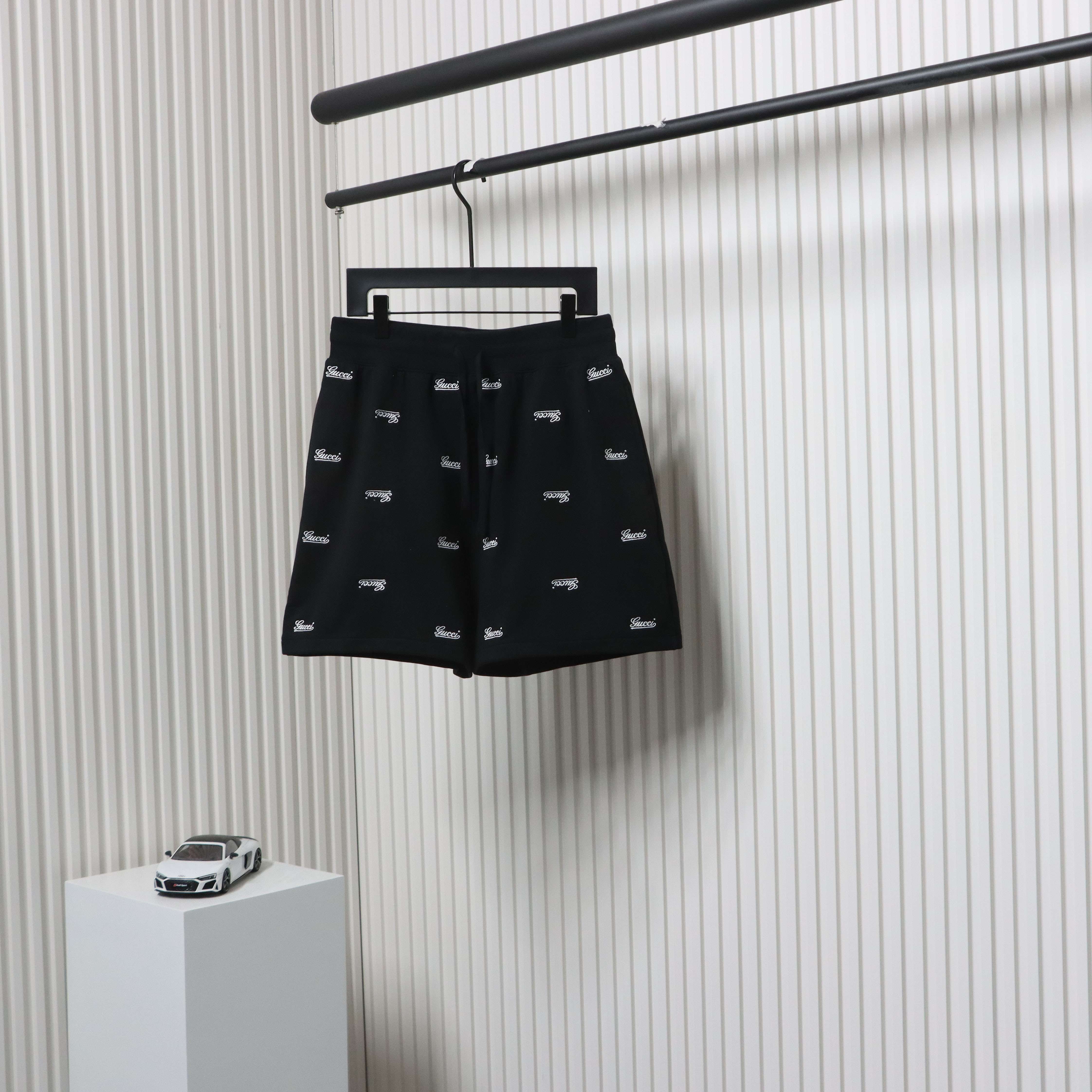 Gucci all over embroidered logo shorts black
