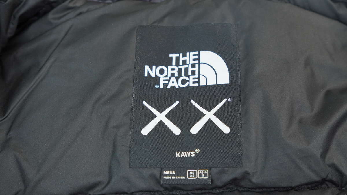   |  The North Face Splicing black XX KAWS 1996 Nuptse Jacket