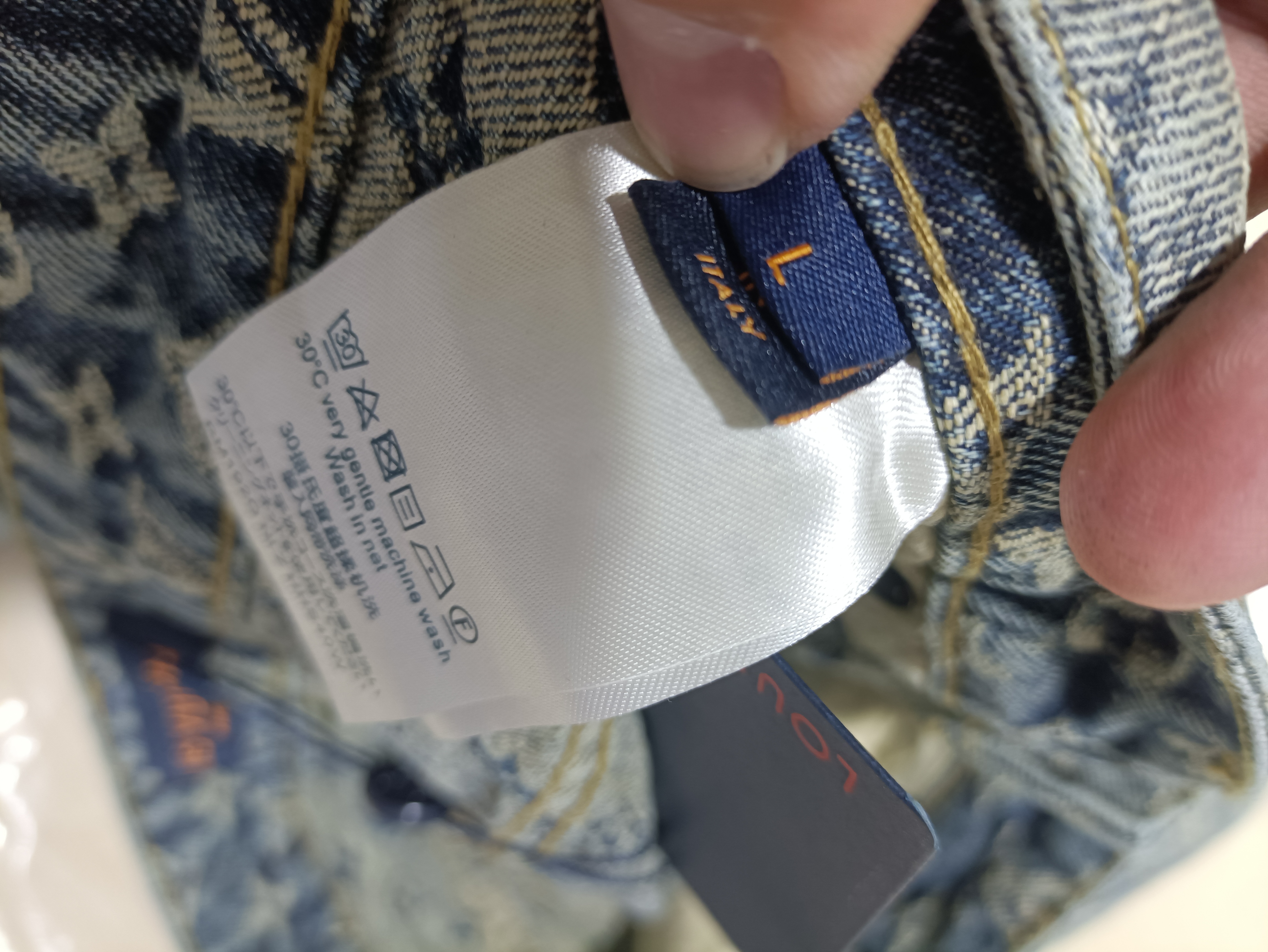 Louis Vuitton distressed washed full print denim shorts Jeans