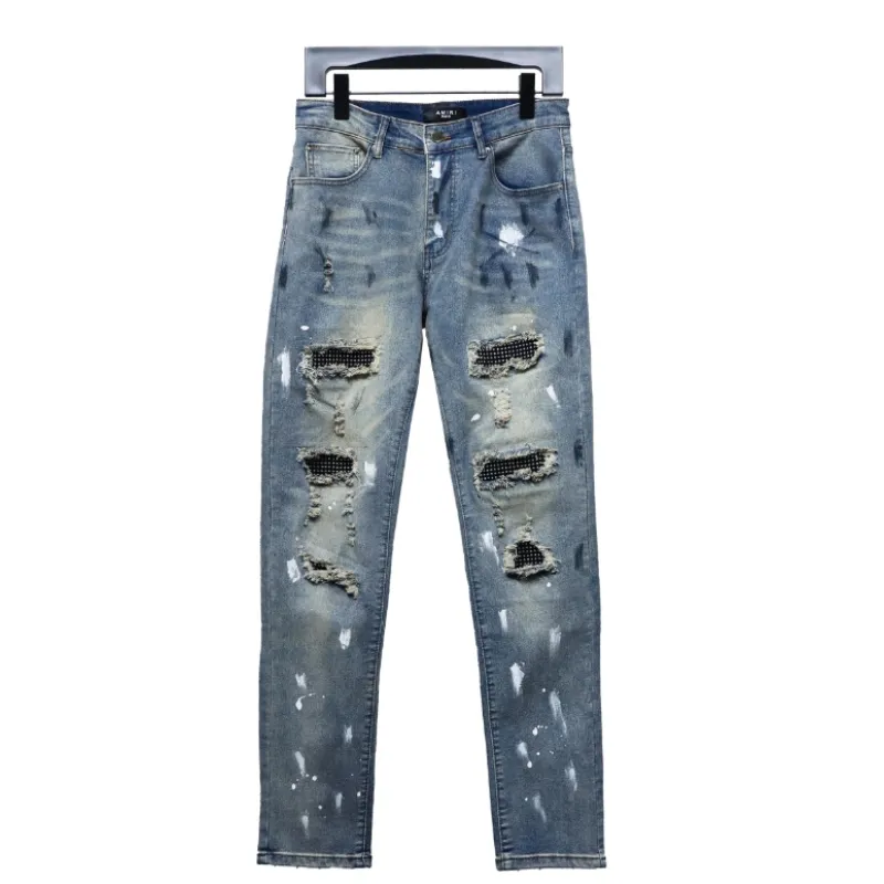 AMIRI ink-splashed rhinestone jeans