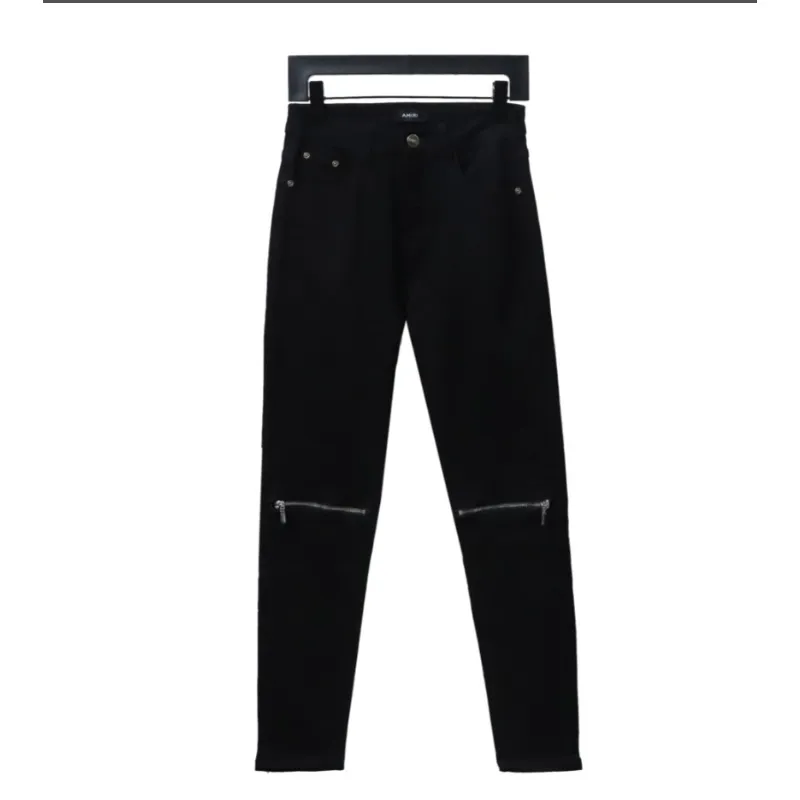 AMIRI MX1 zip-up washed stretch denim trousers