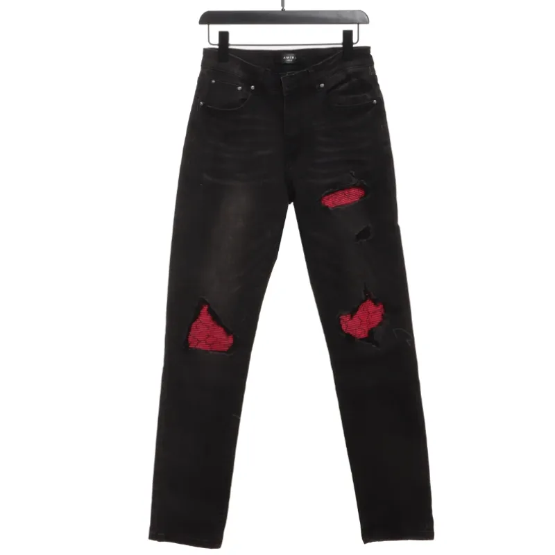 AMIRI pink ripped denim trousers